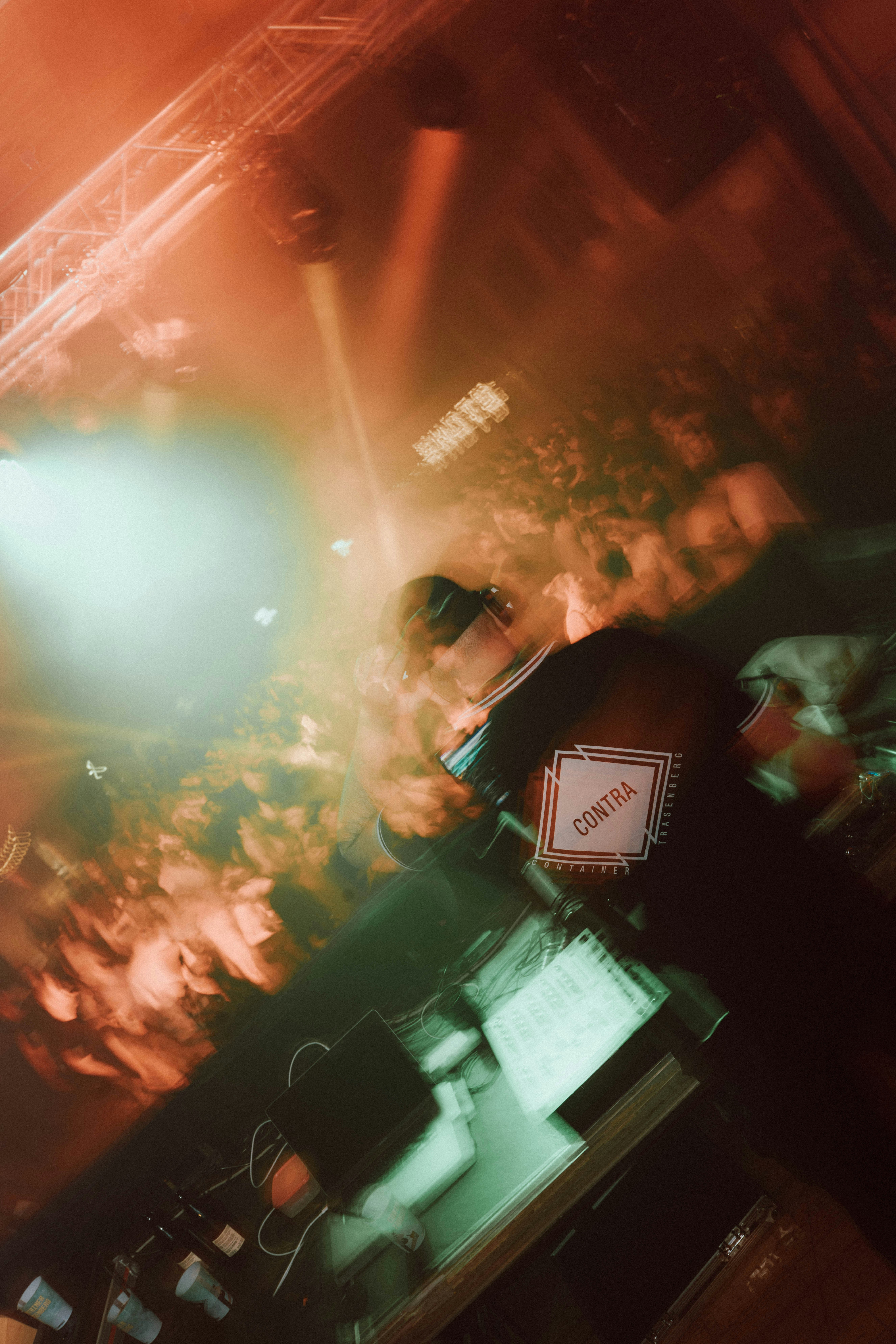 A blurry photo of a person playing a video game