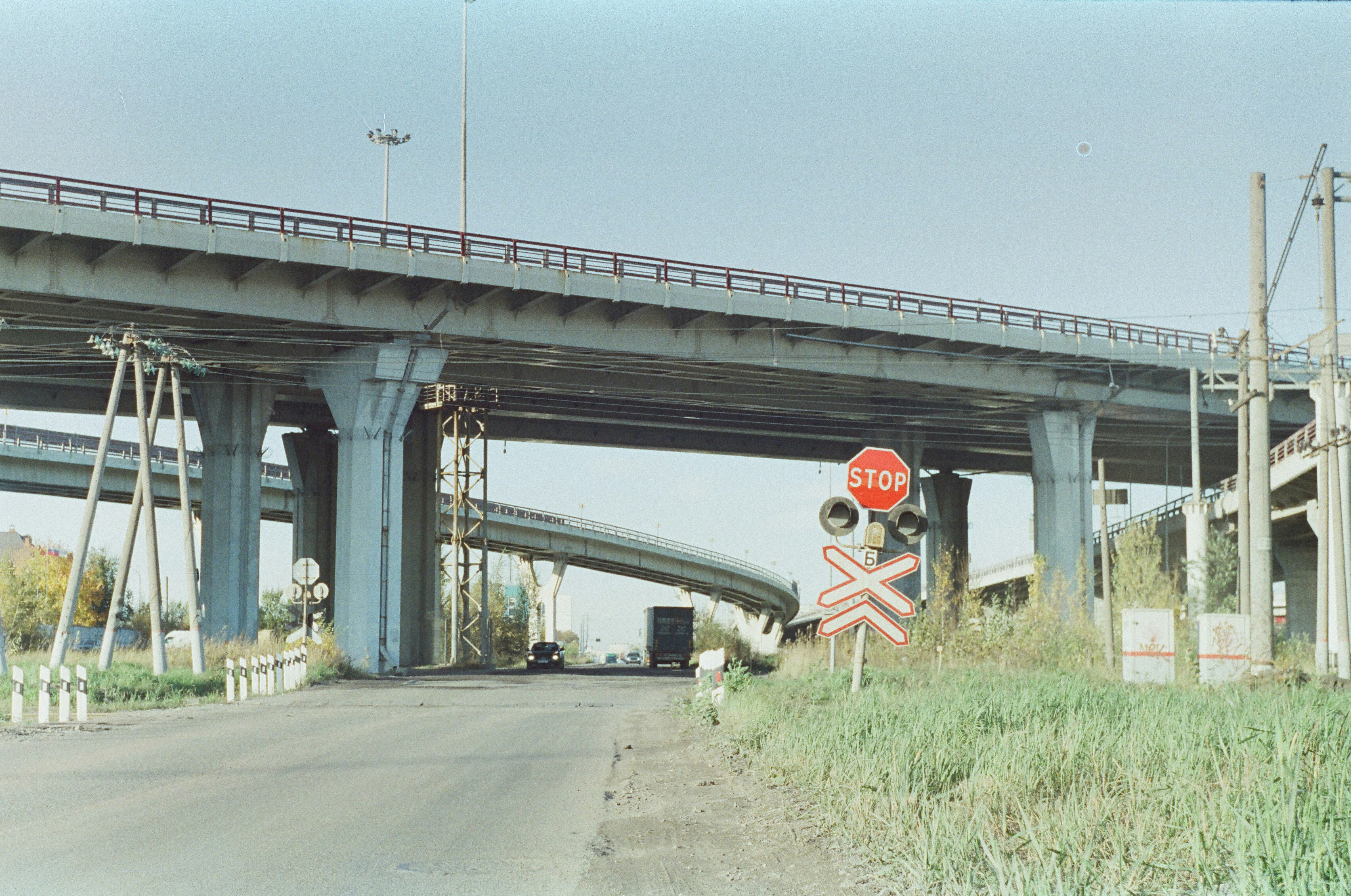 A red stop sign sitting on the side of a road