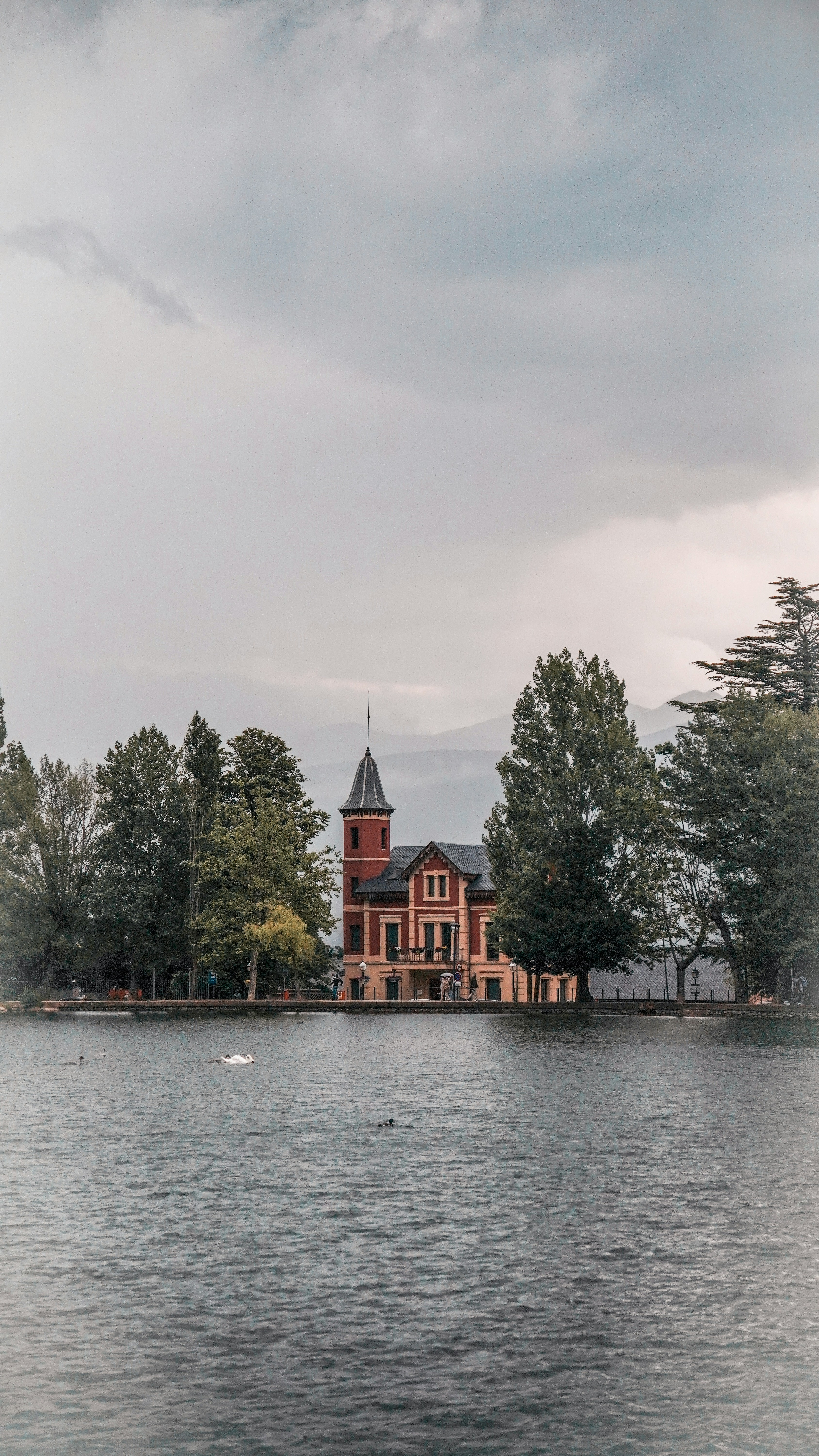 A large building sitting on top of a lake