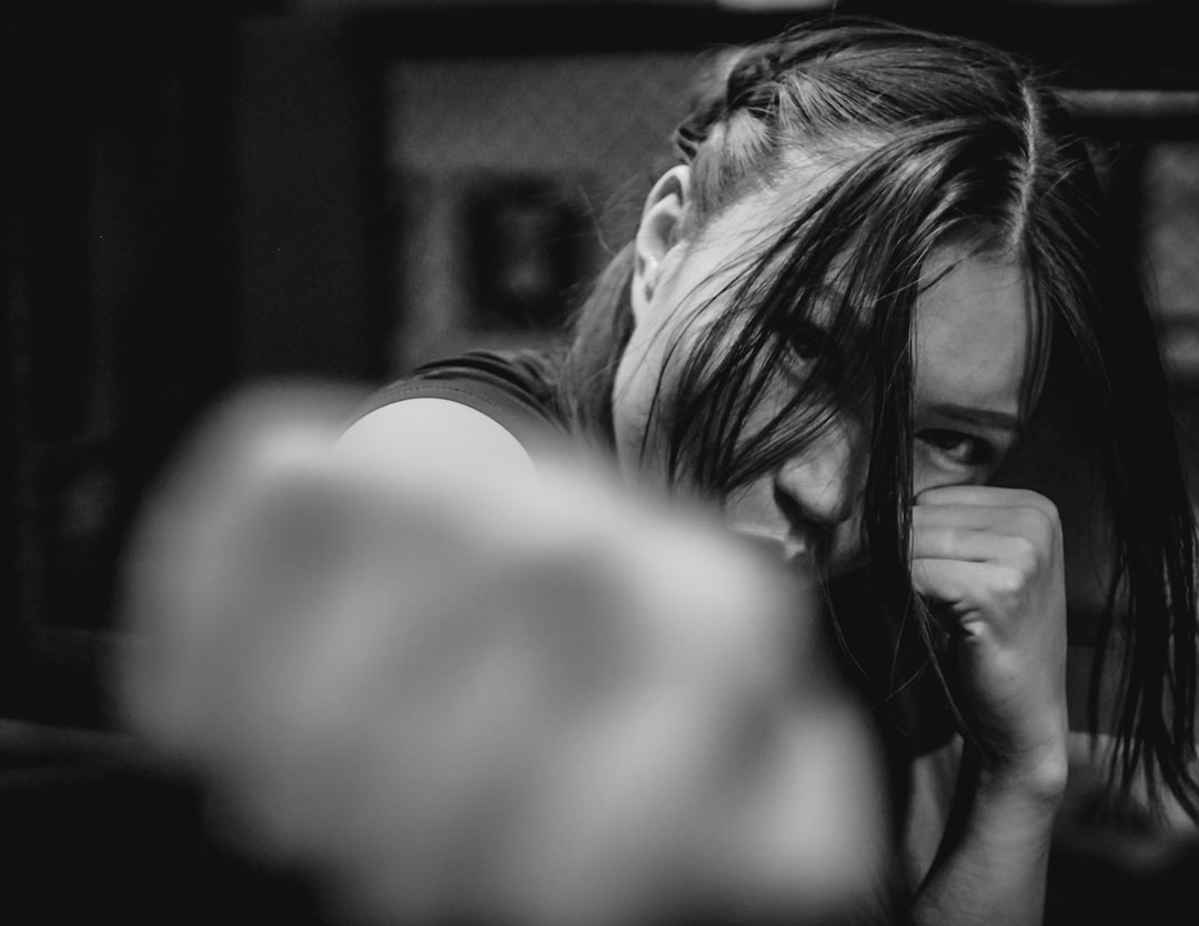 A woman is taking a picture of herself in the mirror, An Asian woman boxing