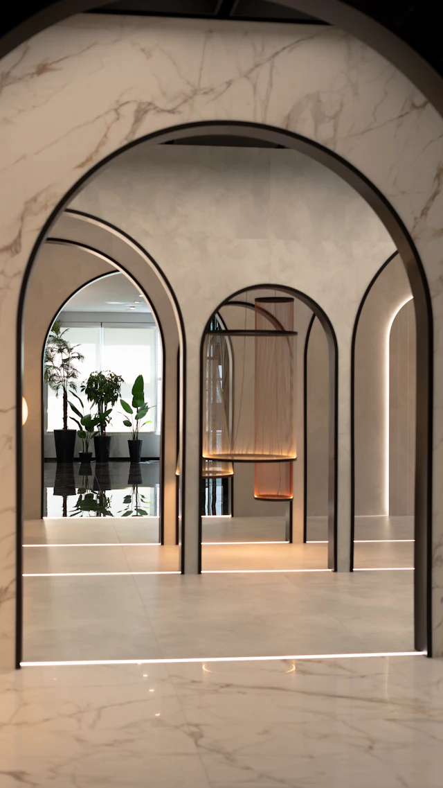 A room with arches and a potted plant