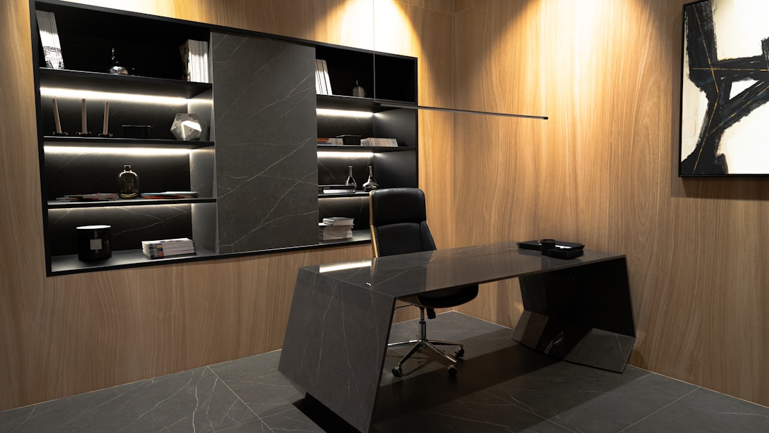 A room with a desk and a chair in it