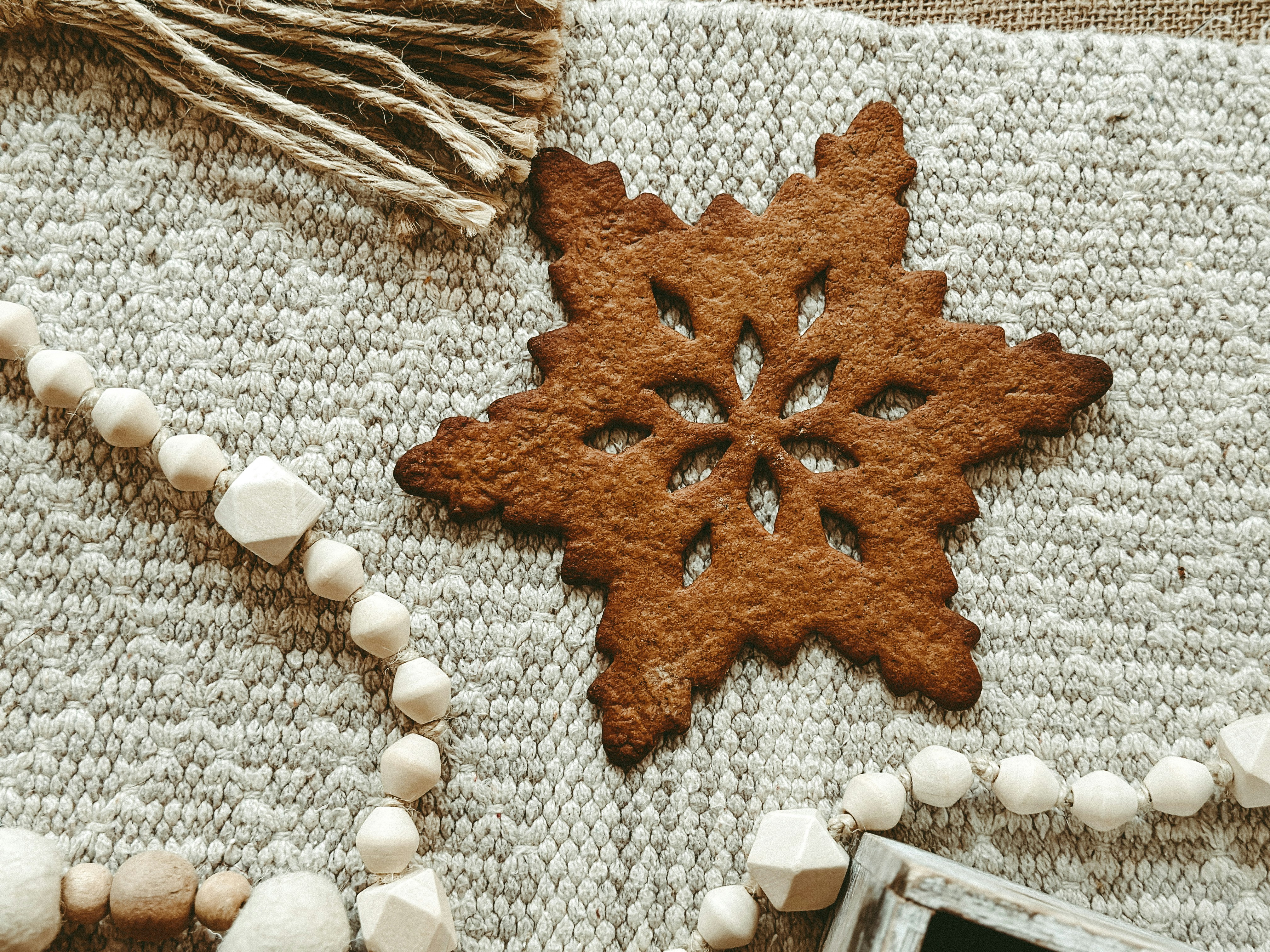 A close up of a piece of fabric with a snowflake ornament