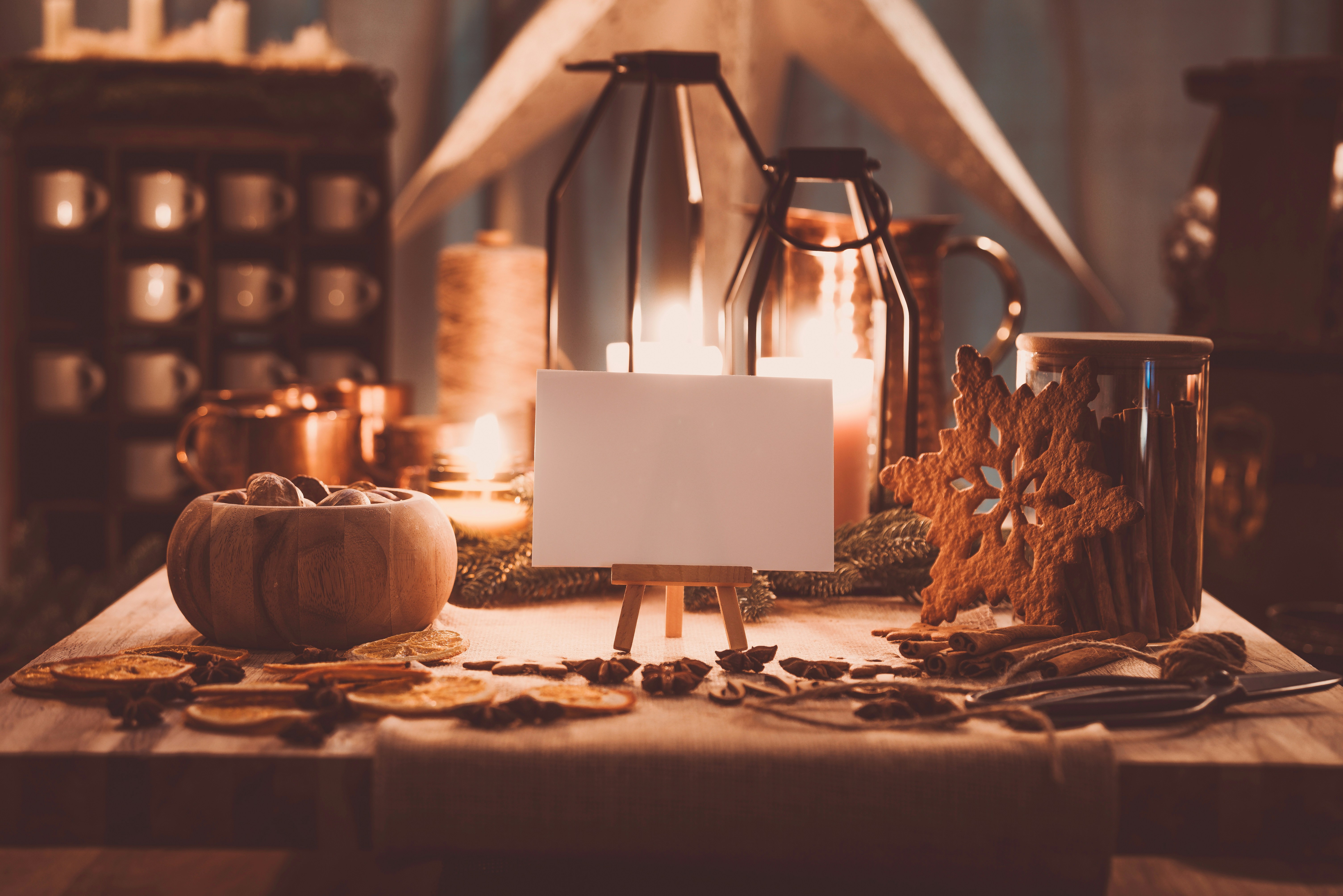 A wooden table topped with lots of candles