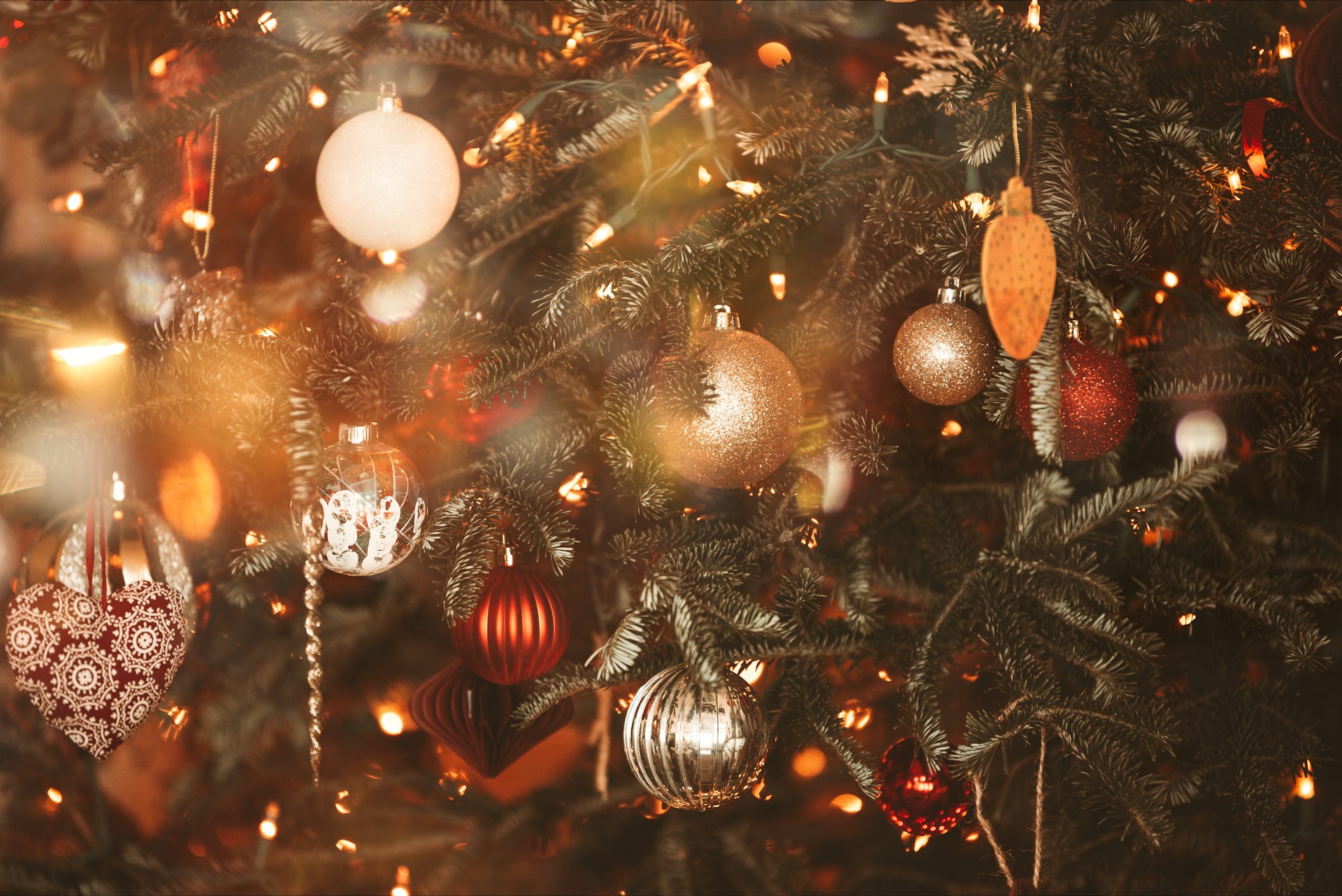 A close up of a christmas tree with ornaments