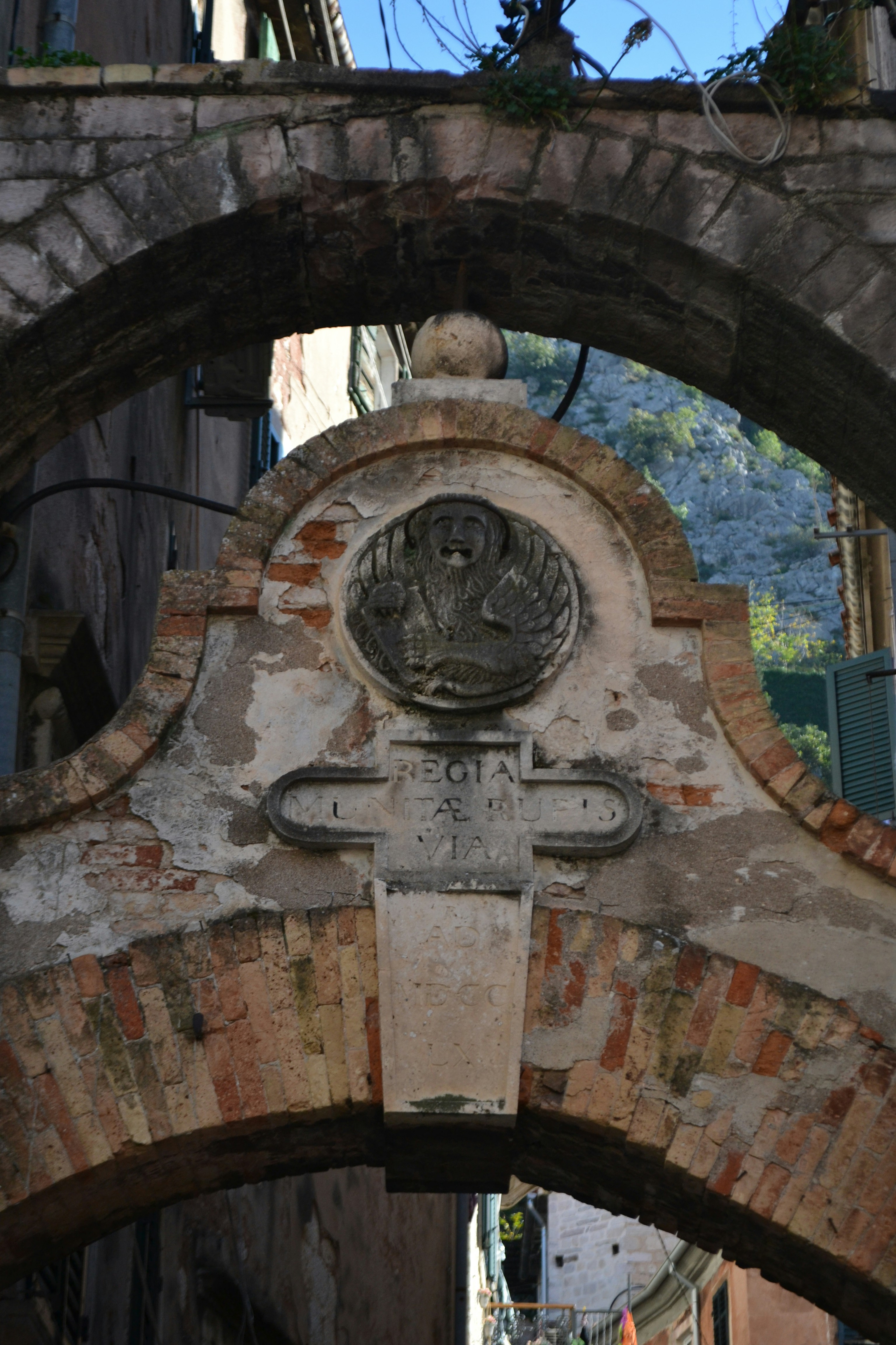A stone arch with a plaque on it