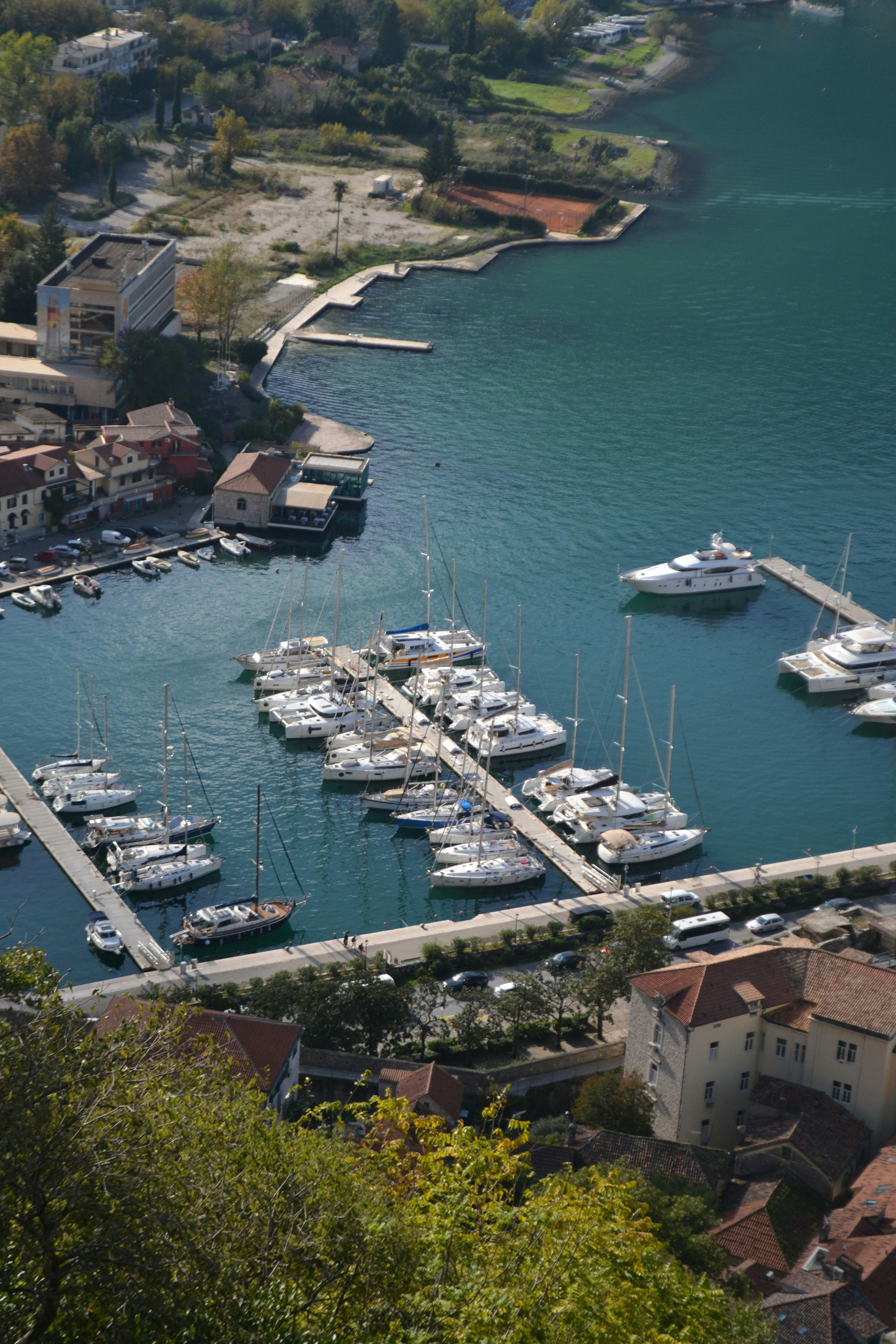An aerial view of a marina with many boats