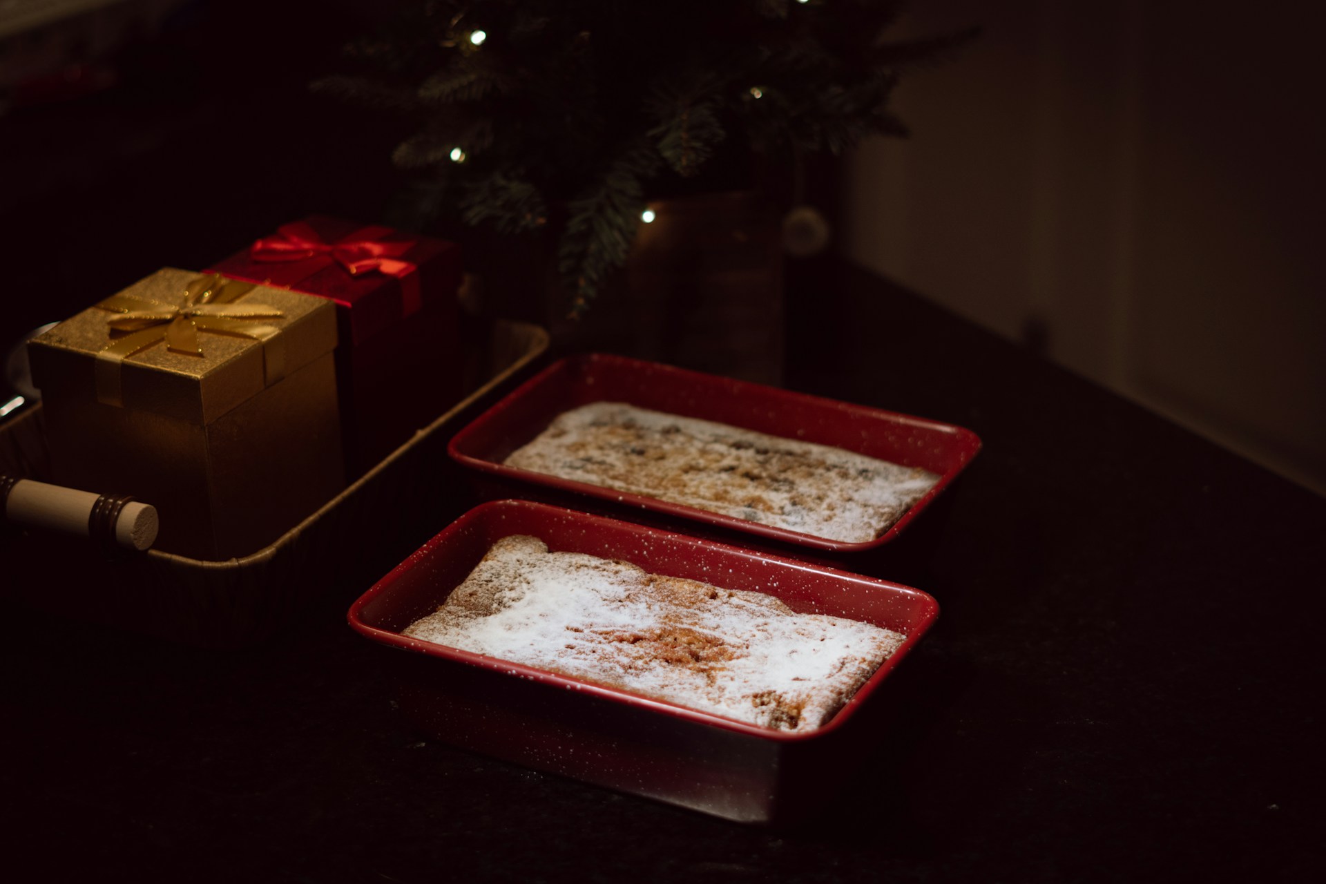A couple of trays of food sitting on top of a table