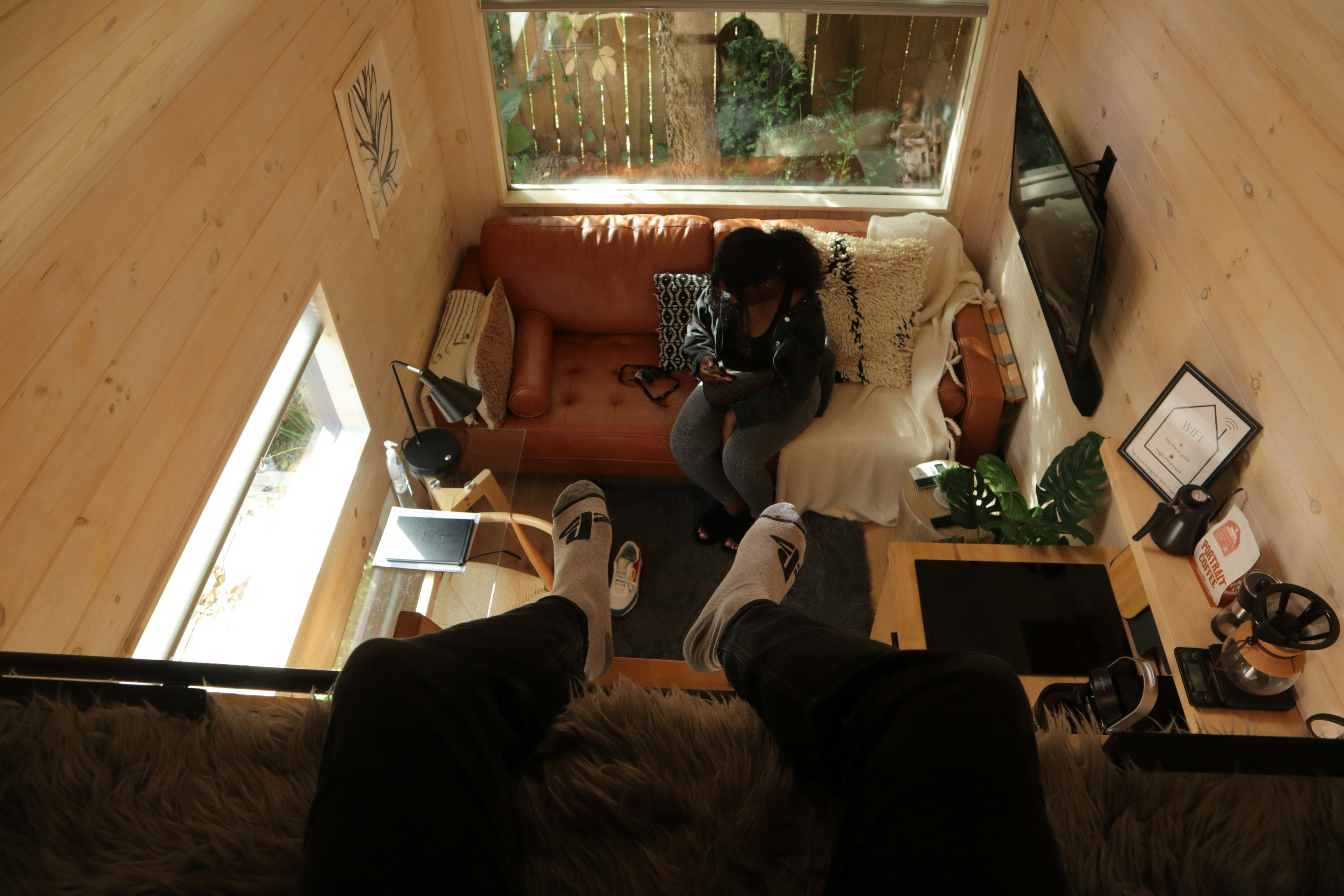 A person sitting on a couch in a living room