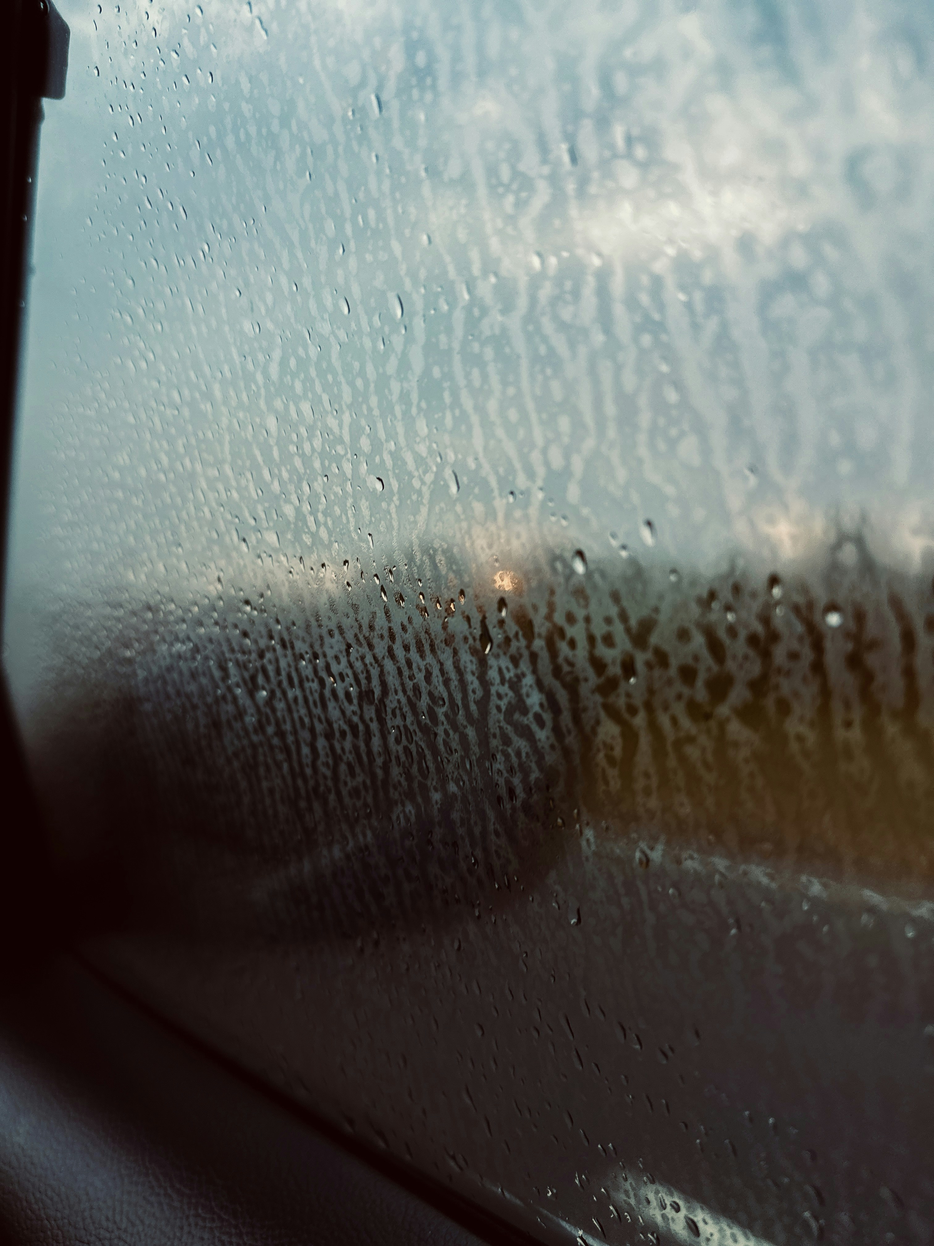 A window with rain drops on the glass