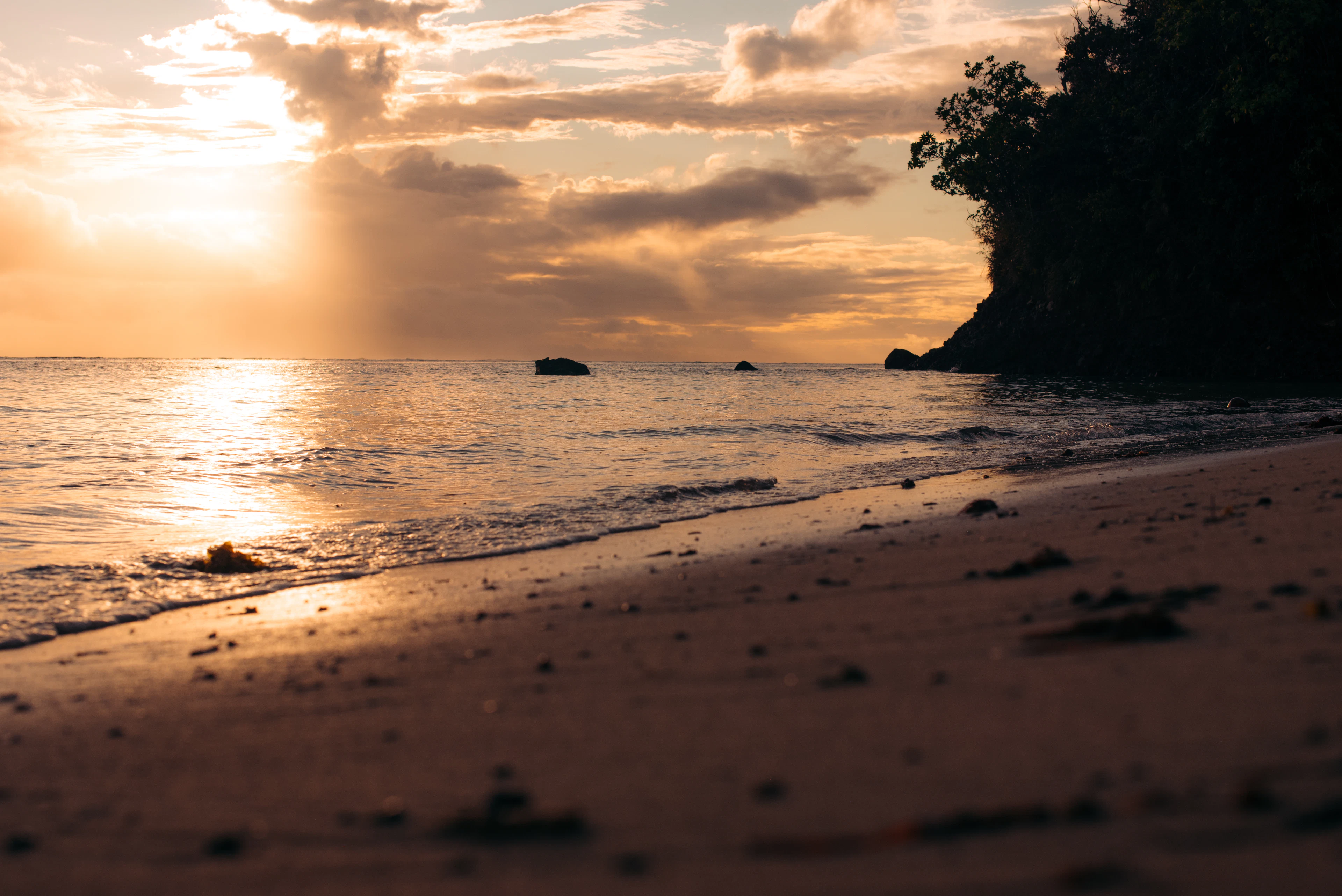 Soft evening light over the sea and a sandy beach at Korolevu on Viti Levu's Coral Coast