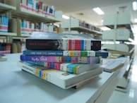 A stack of books sitting on top of a table