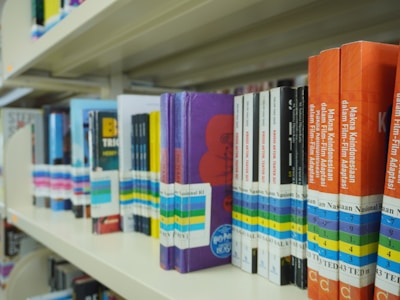 A row of books on a shelf in a library