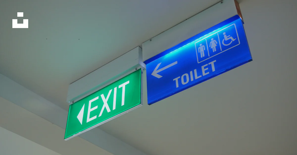 Exsit Sign Blue A blue and green exit sign hanging from a ceiling photo – Free Sign ...