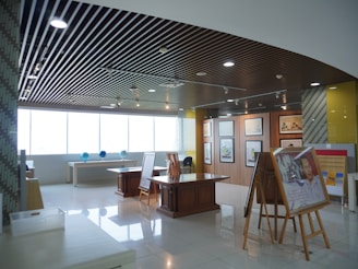 A large room with a lot of paintings on the wall