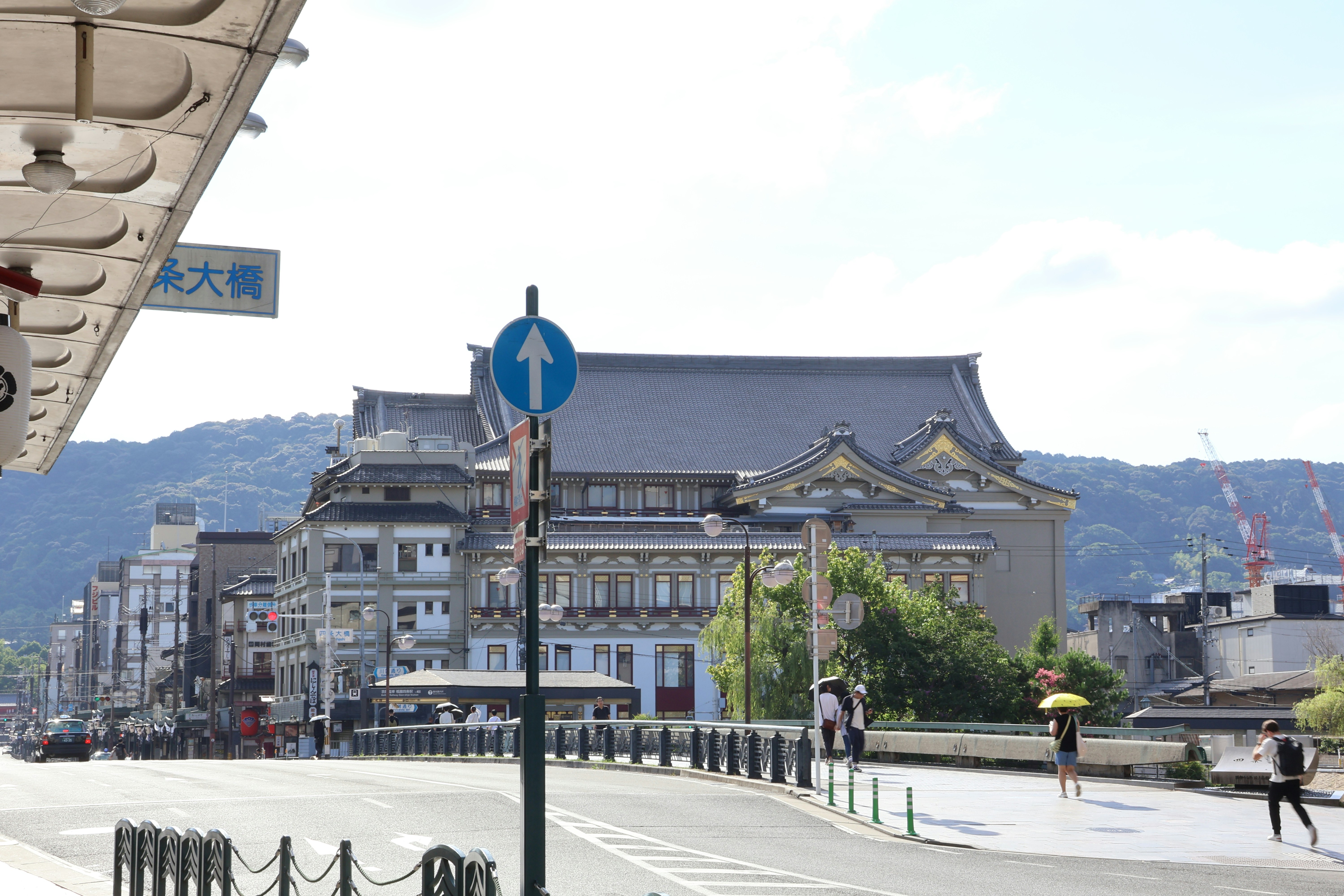 A view of a street with a building in the background