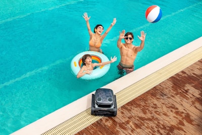 A couple of people that are in a pool