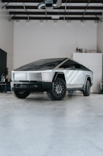 A futuristic car is parked in a garage