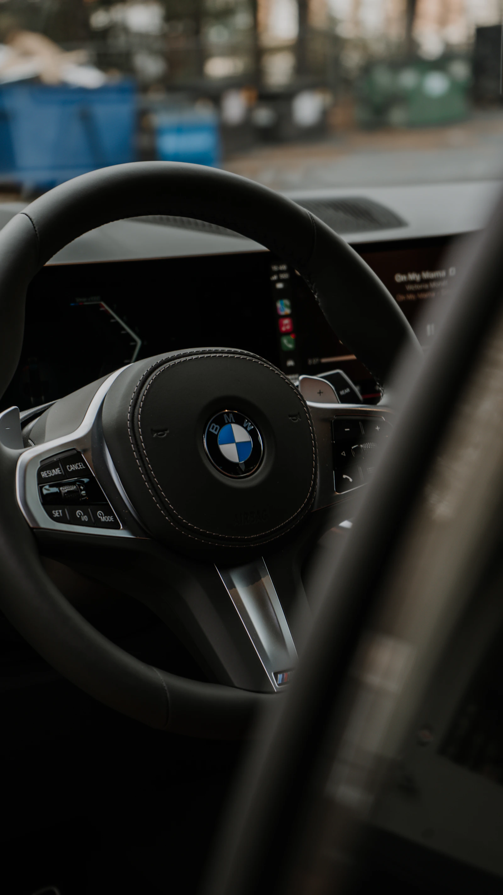 Premium car interior showing dashboard, steering wheel, and modern automotive controls