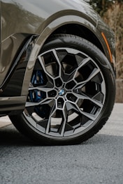 A close up of a car tire on a street