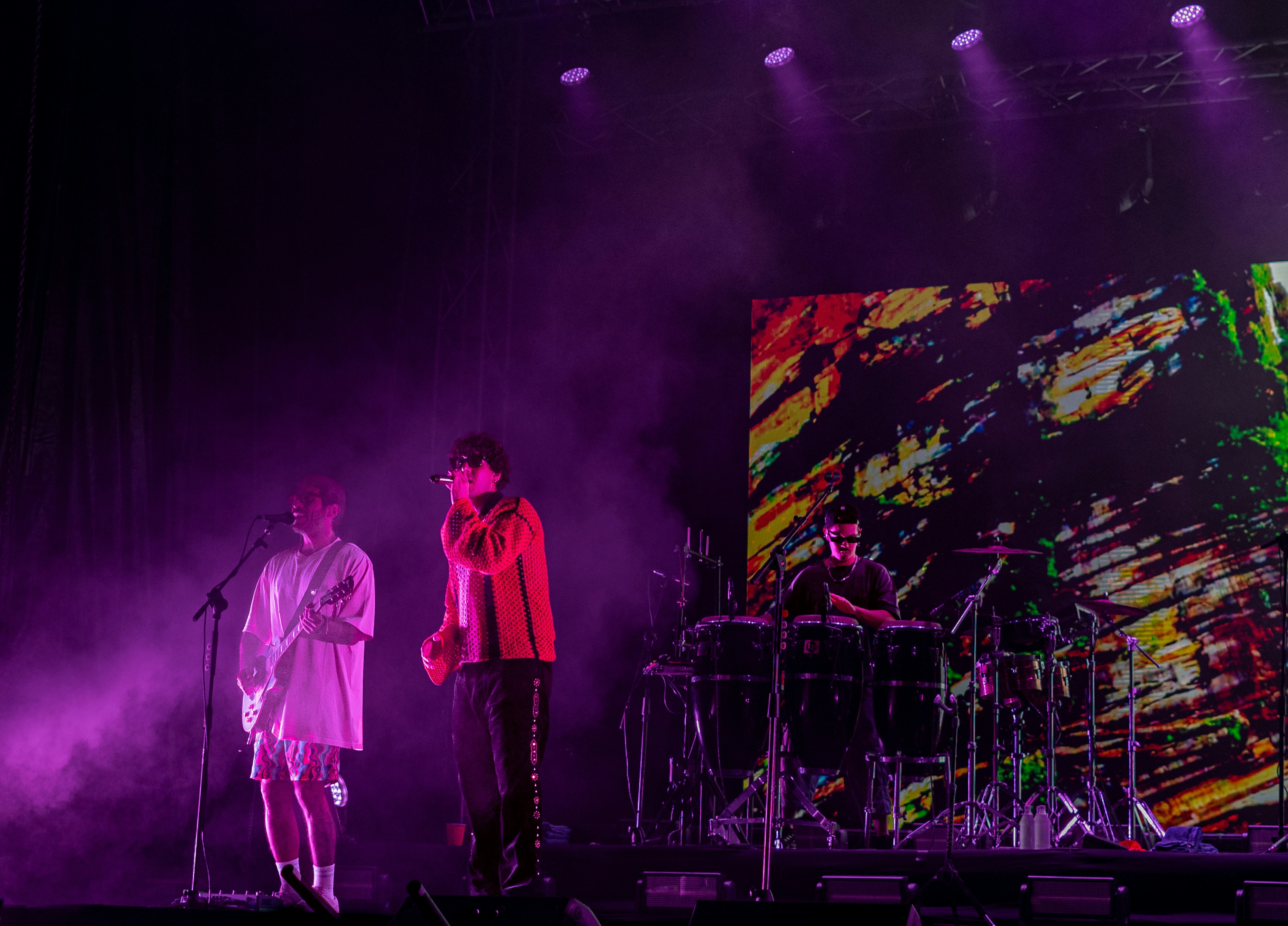 A group of people standing on top of a stage