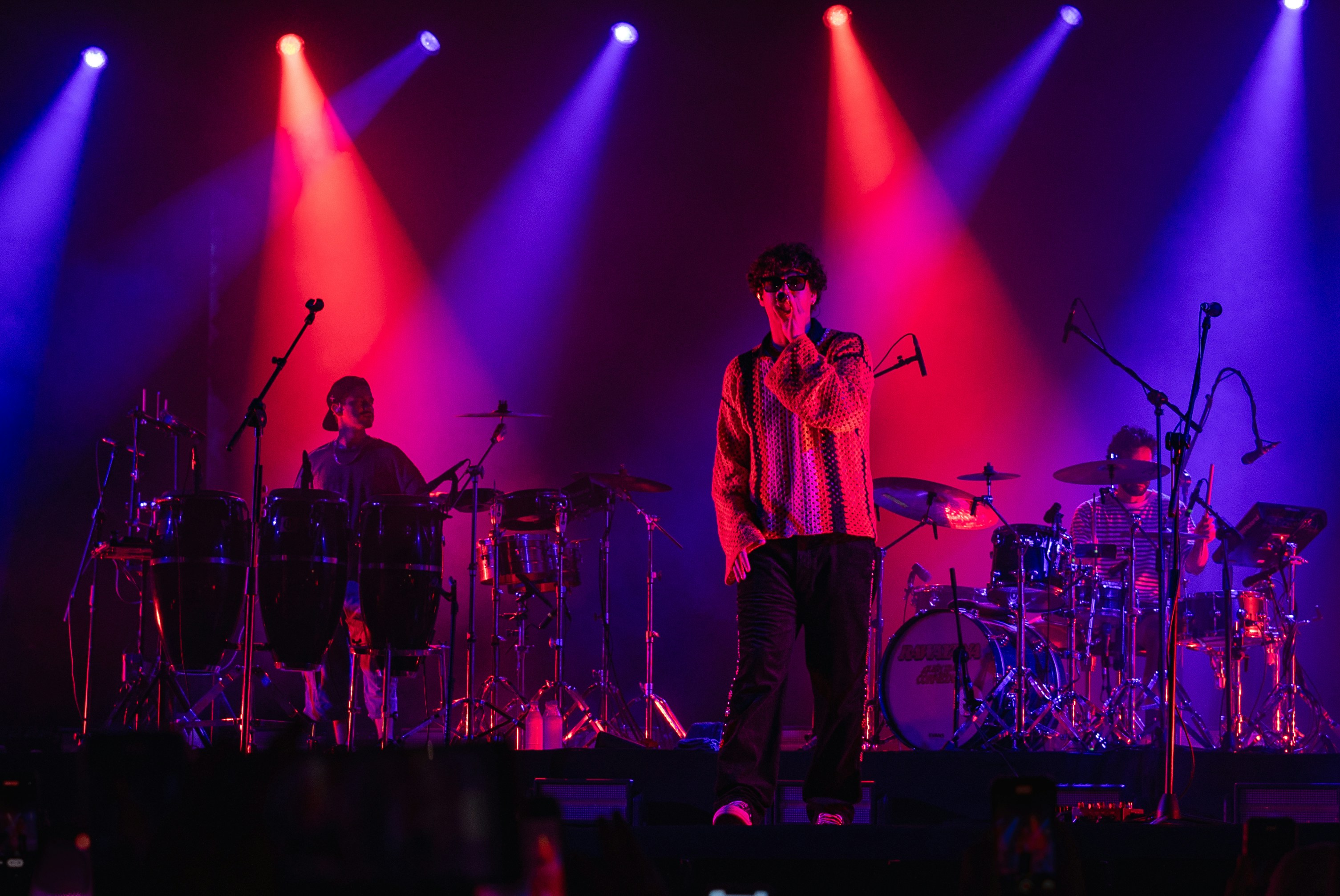 A group of people on a stage with lights