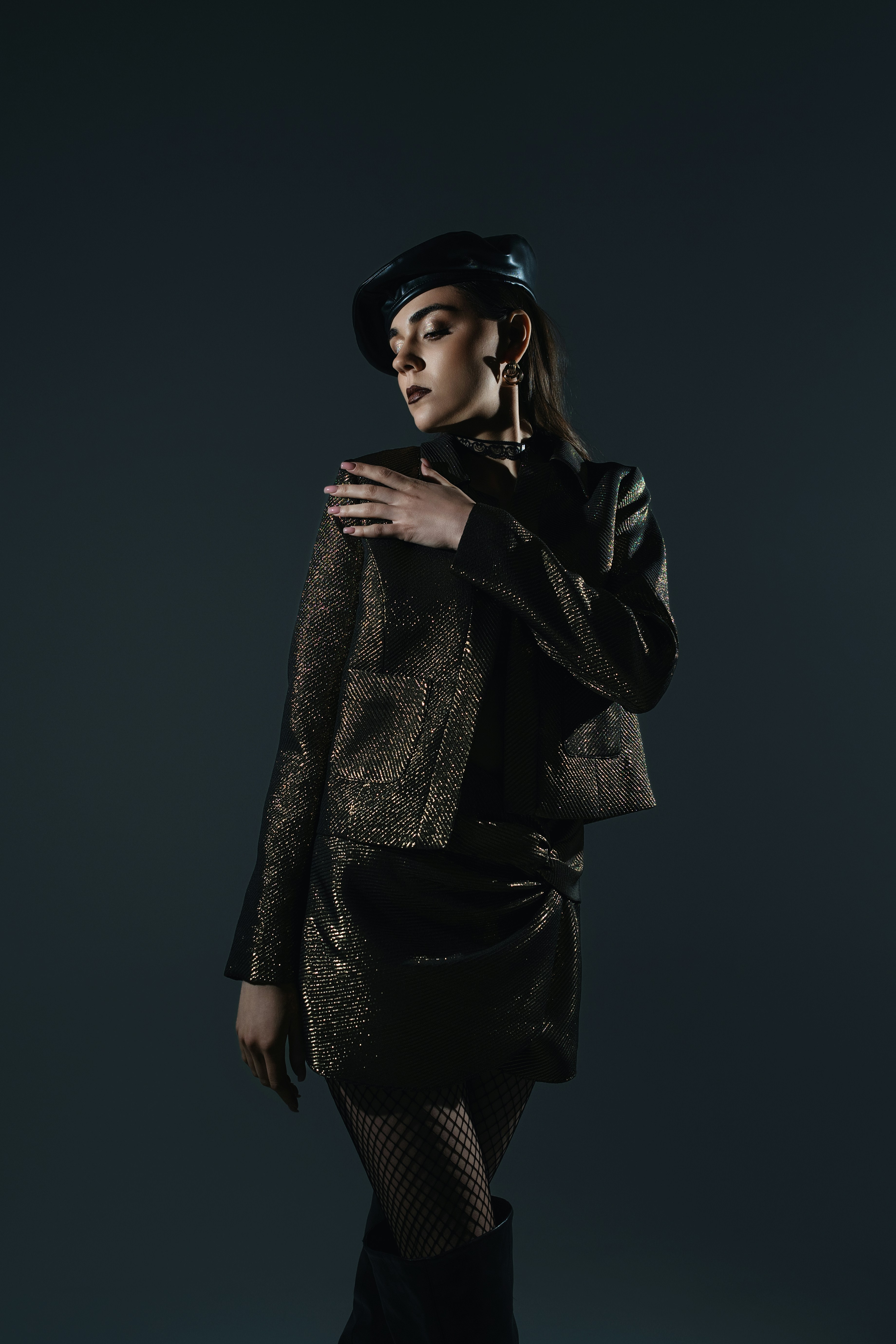 A woman in a black and silver outfit