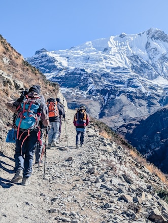 A group of people hiking up a mountain