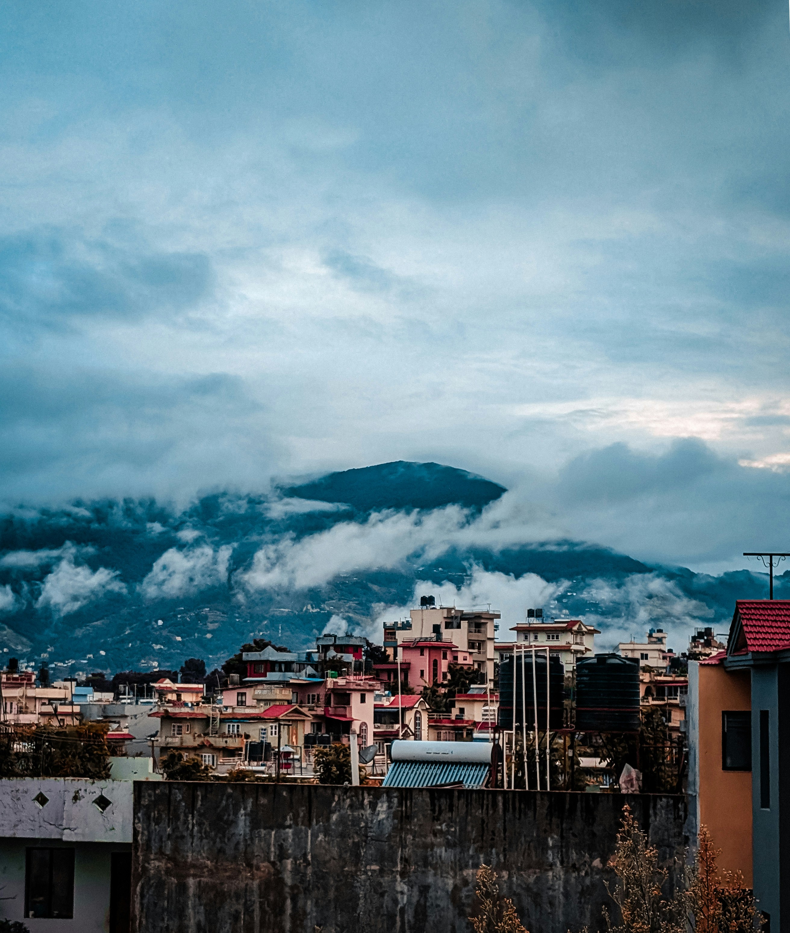 A view of a city with a mountain in the background