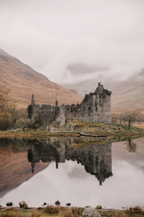 A castle sitting in the middle of a lake