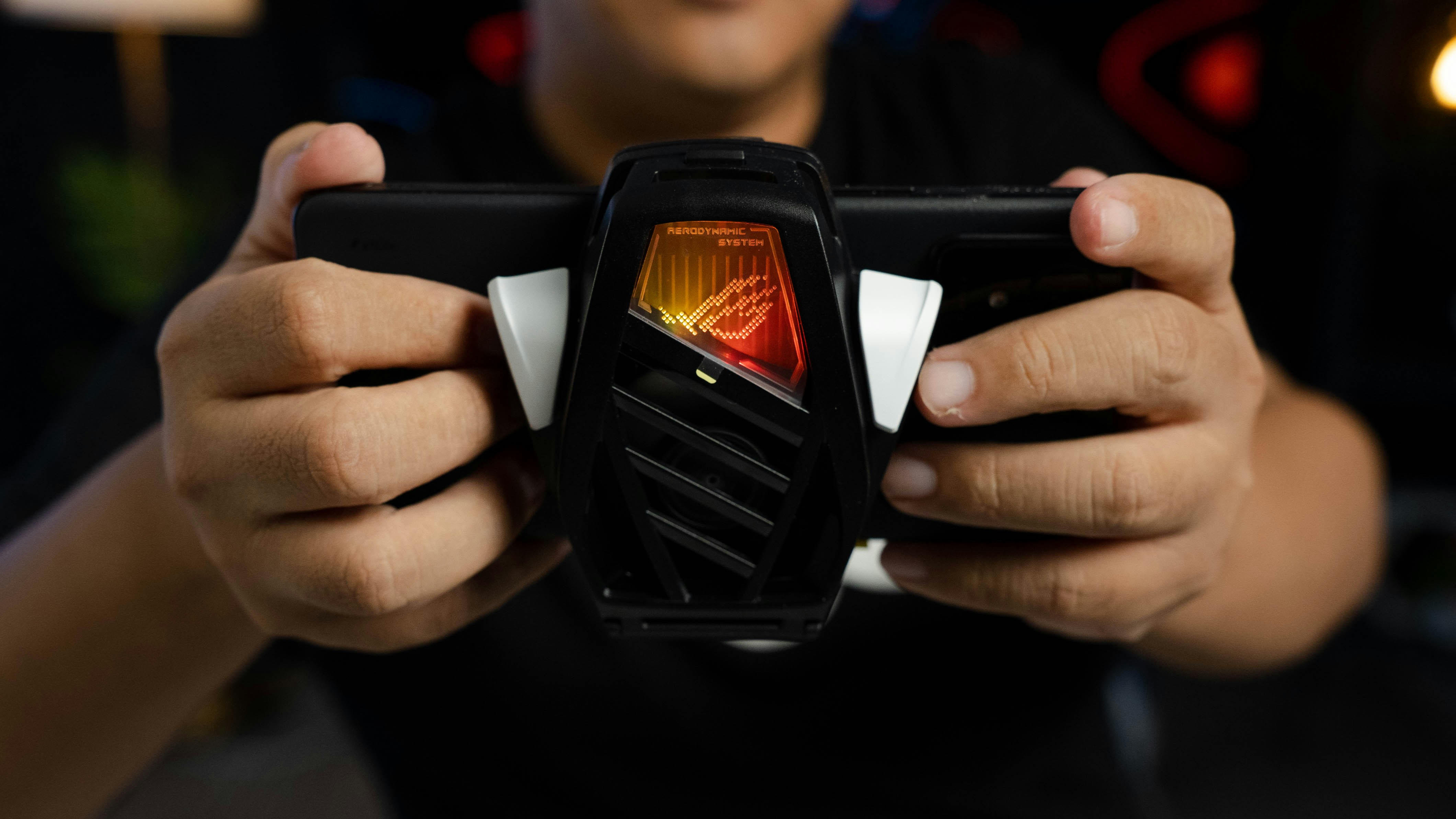 A man holding a cell phone in his hands