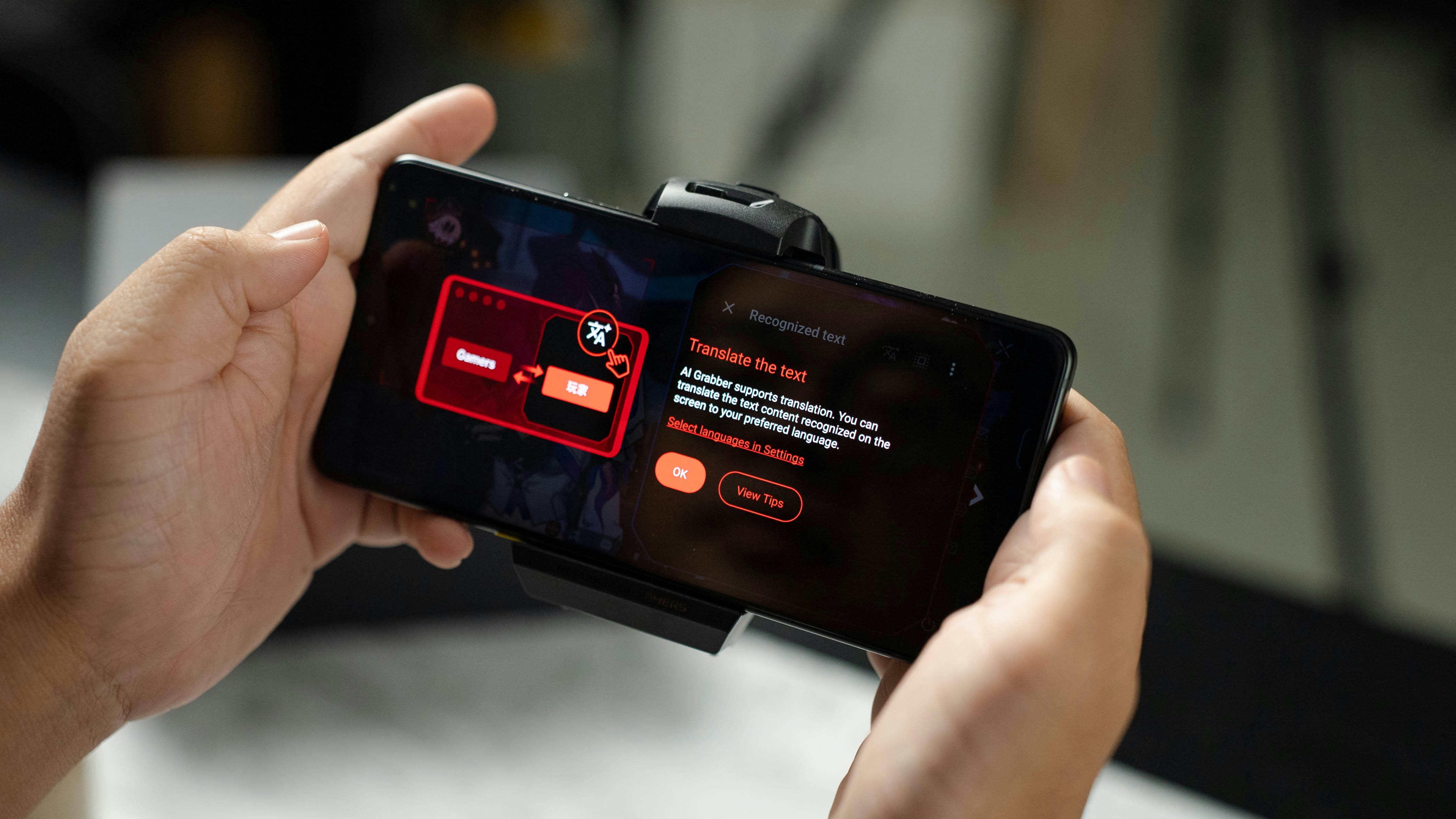 A person holding a cell phone in their hand