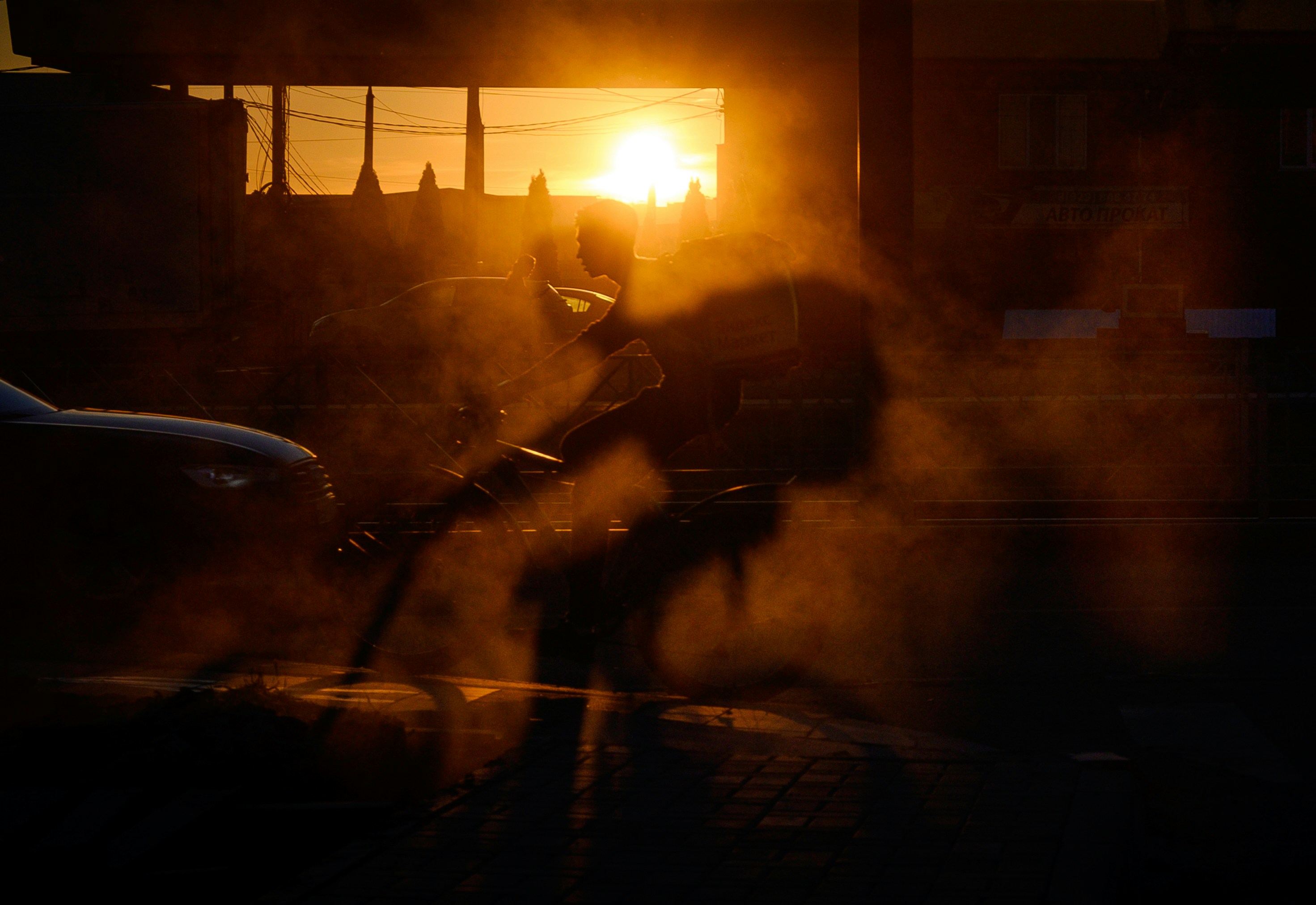 A person riding a bike on a city street