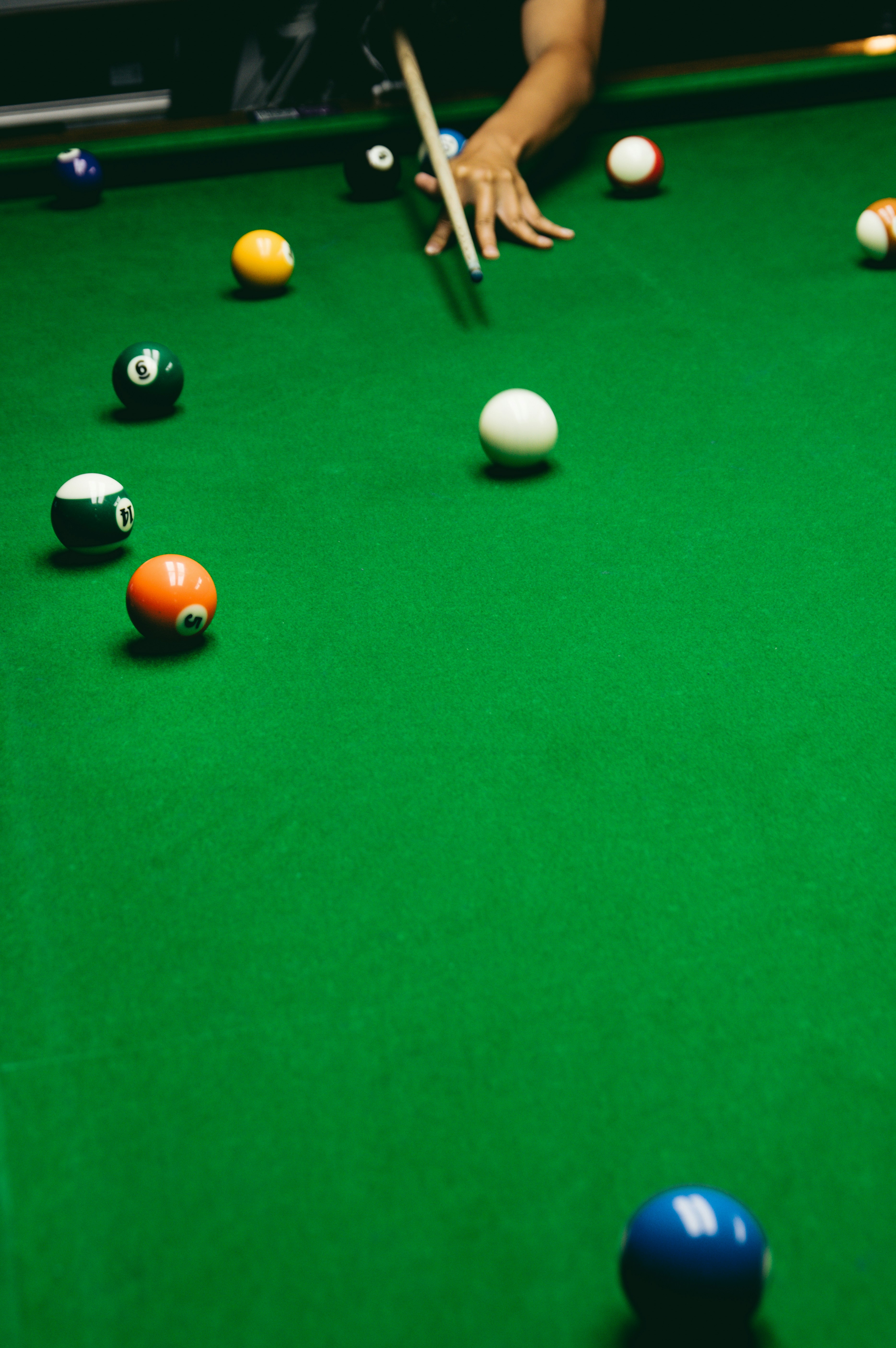A pool table with a pool cue and balls on it photo – Free Human Image ...