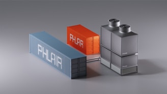 A group of three metal containers sitting next to each other