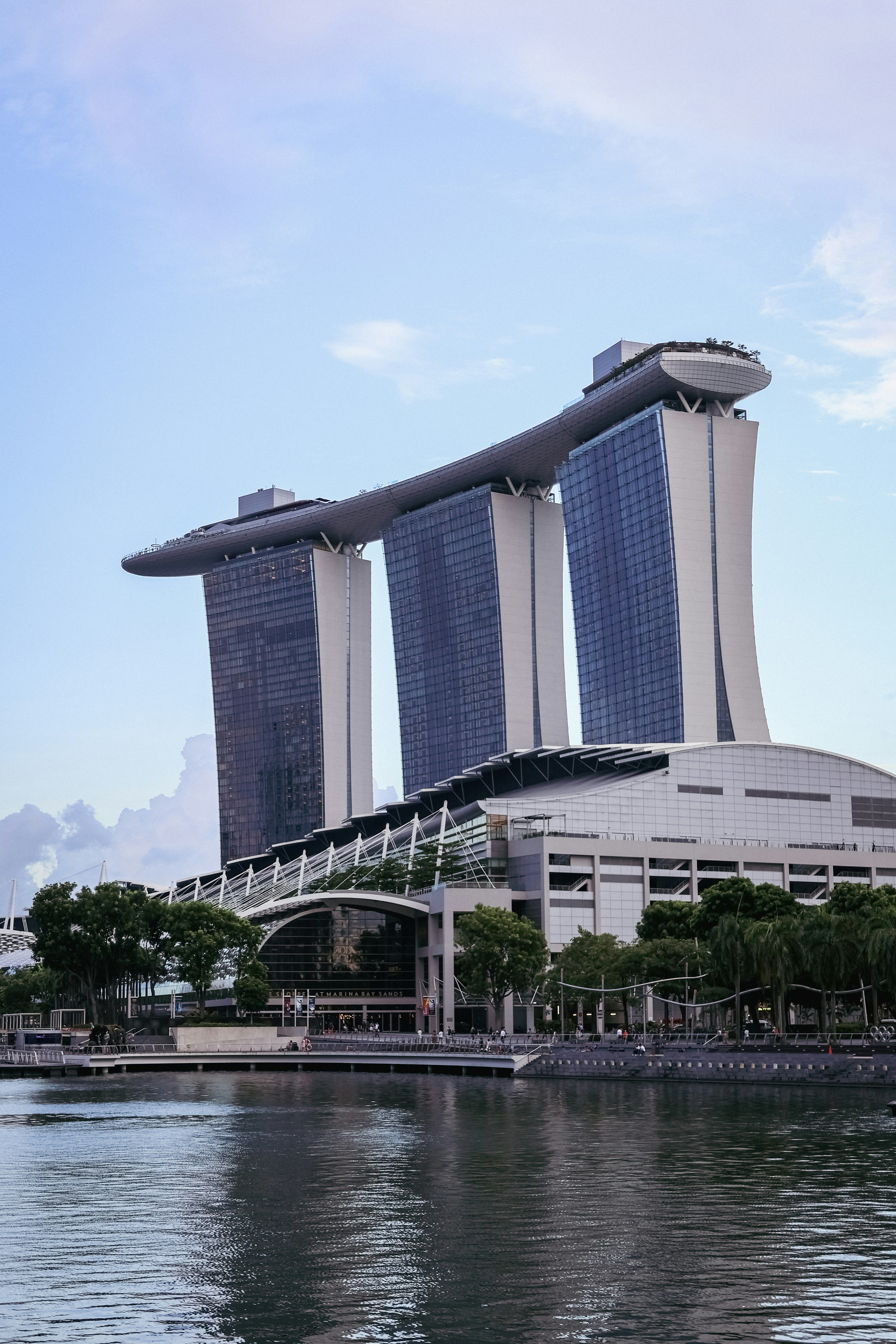 A large body of water next to a tall building