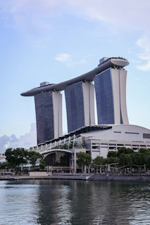 A large body of water next to a tall building