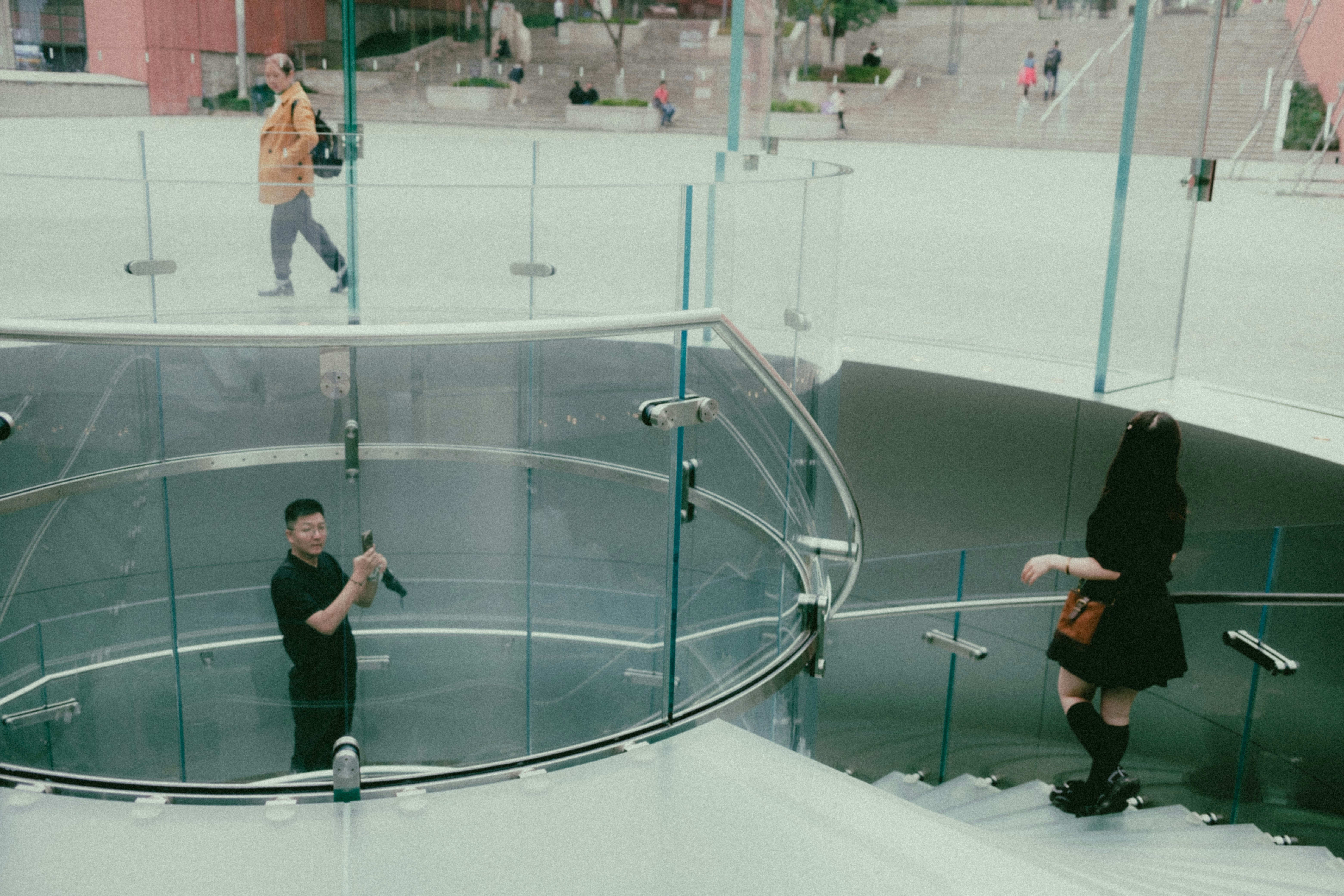 A group of people walking down a set of stairs