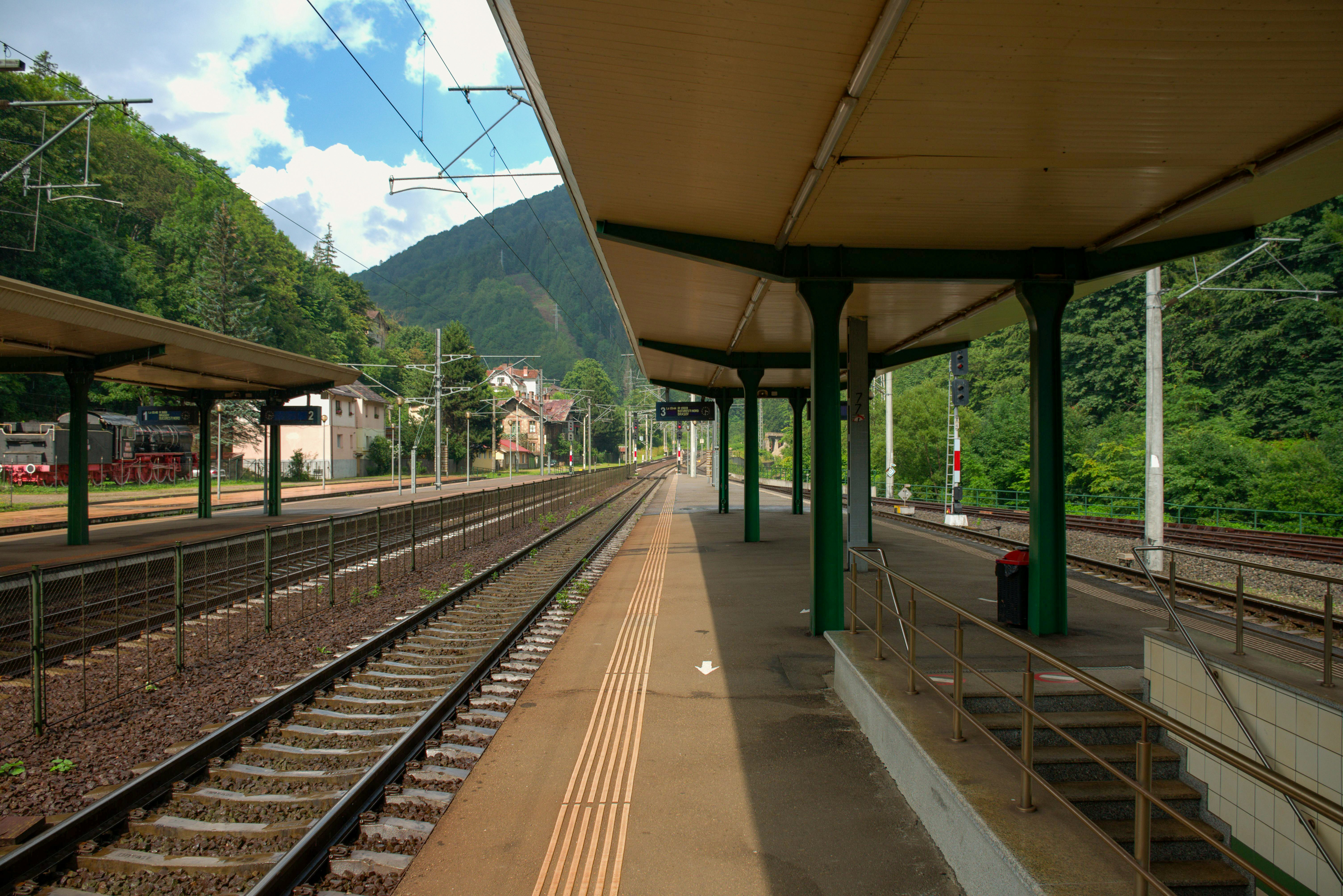 A train station with a train on the tracks