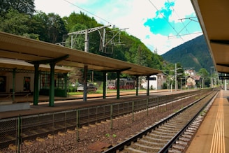 A train station with a train on the tracks