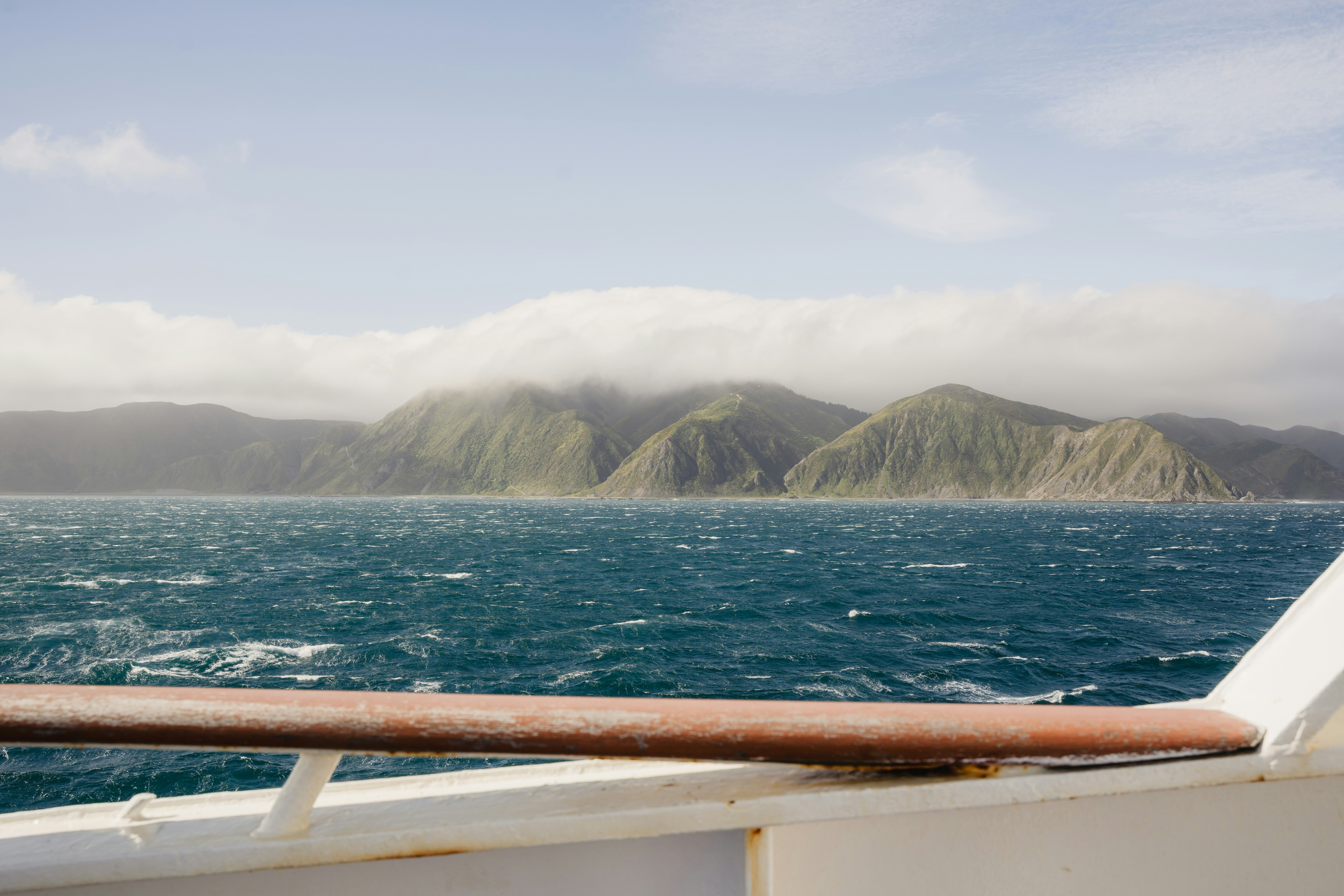 A view of a body of water with mountains in the background