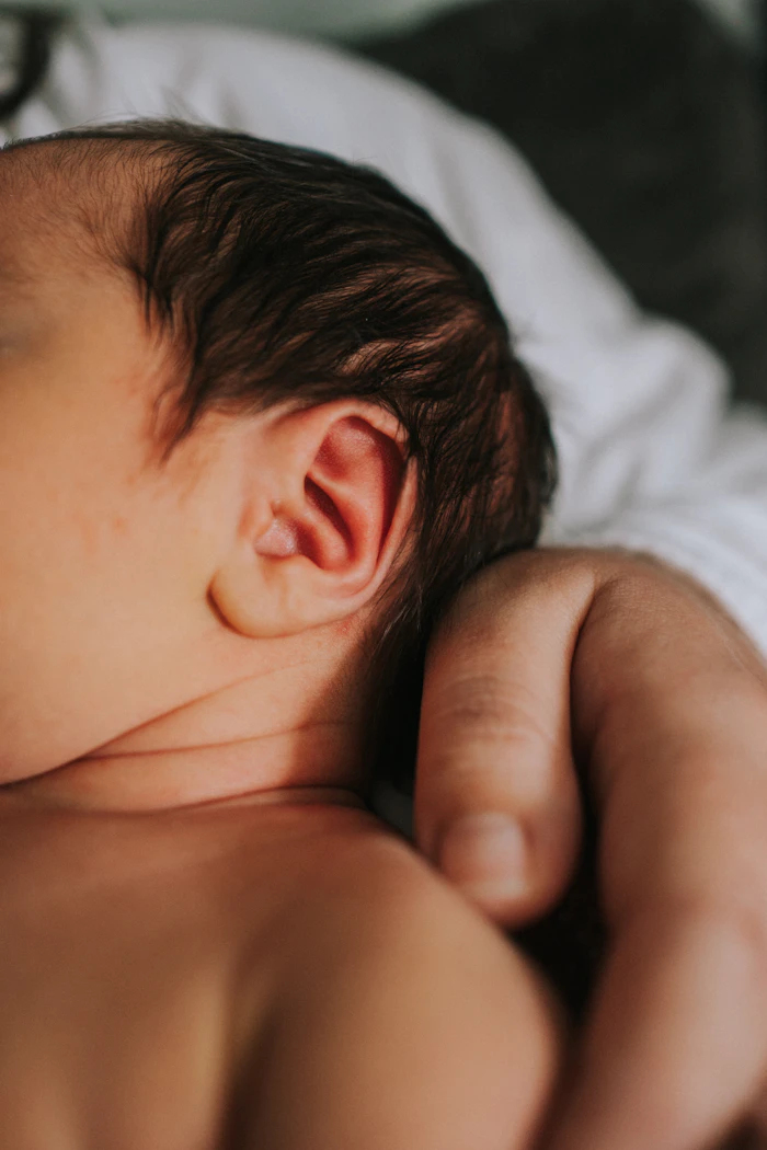 A mother holding her newborn