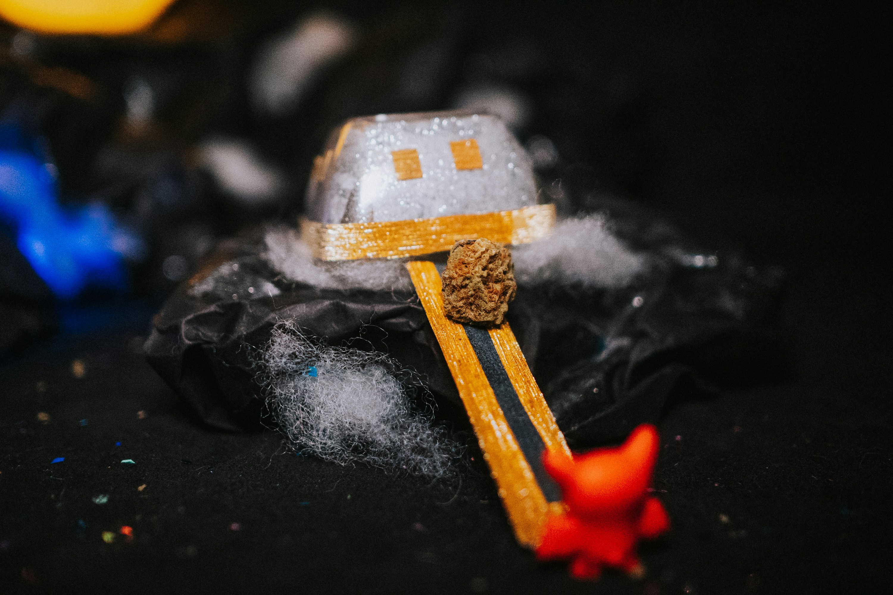 A small toy is sitting on top of a rock