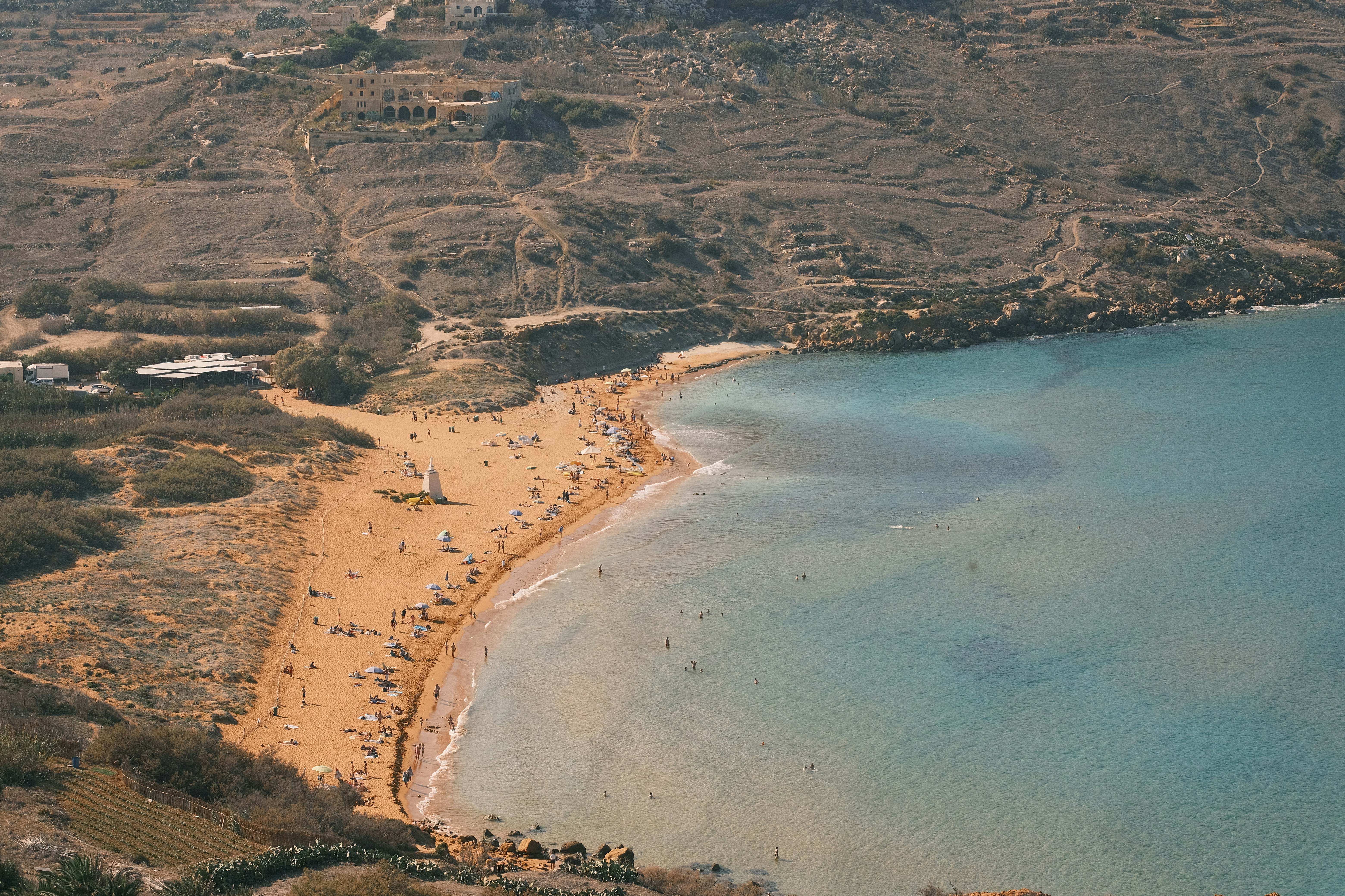 An aerial view of a beach and a body of water