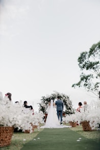 A bride and groom walking down the aisle
