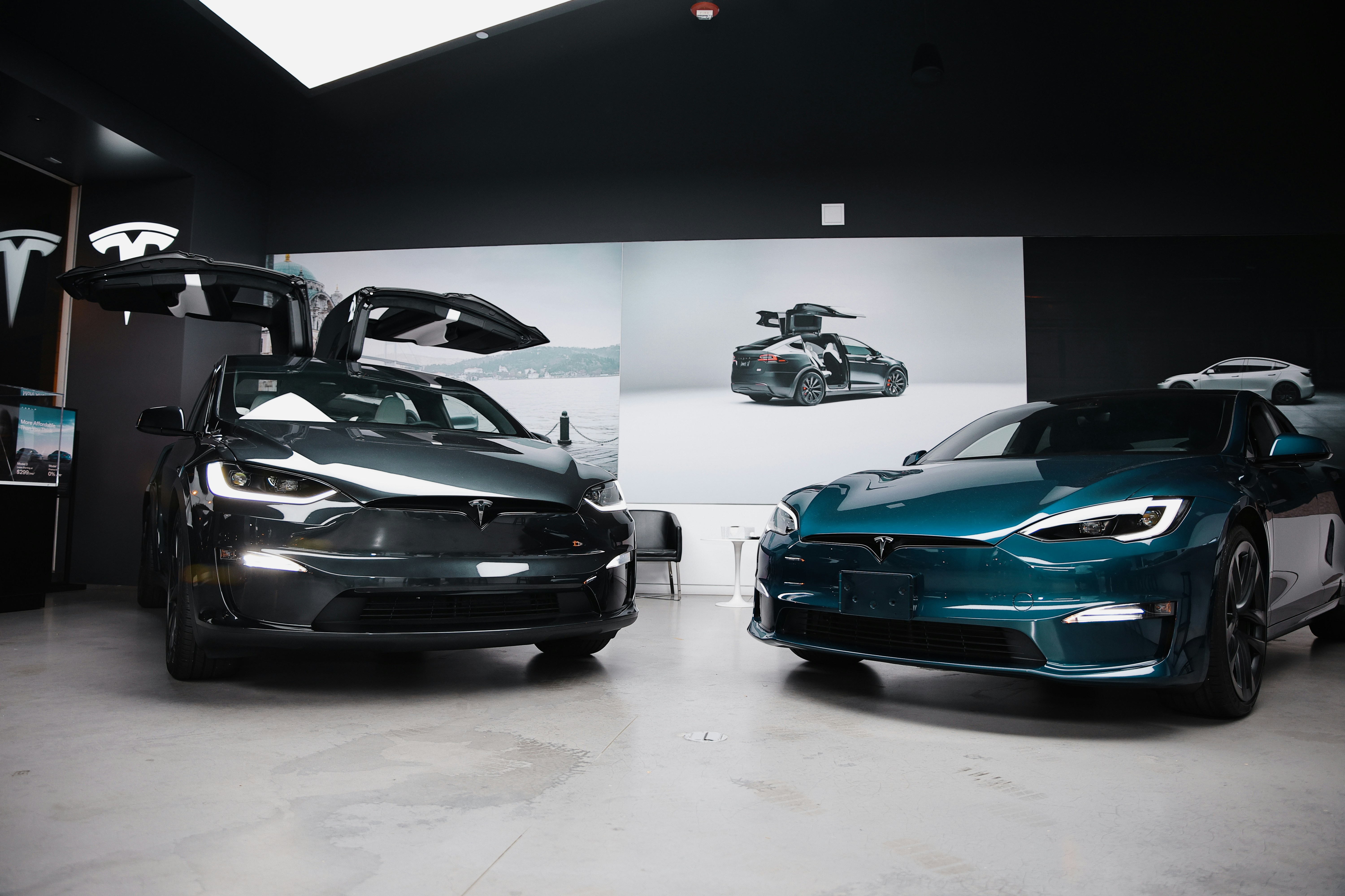 A couple of cars that are in a garage