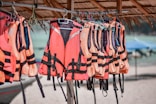 Life vests and life vests hanging from a raft