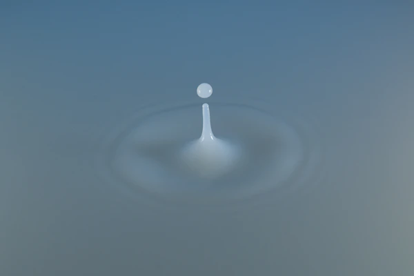 A picture of a drop of water on a blue background