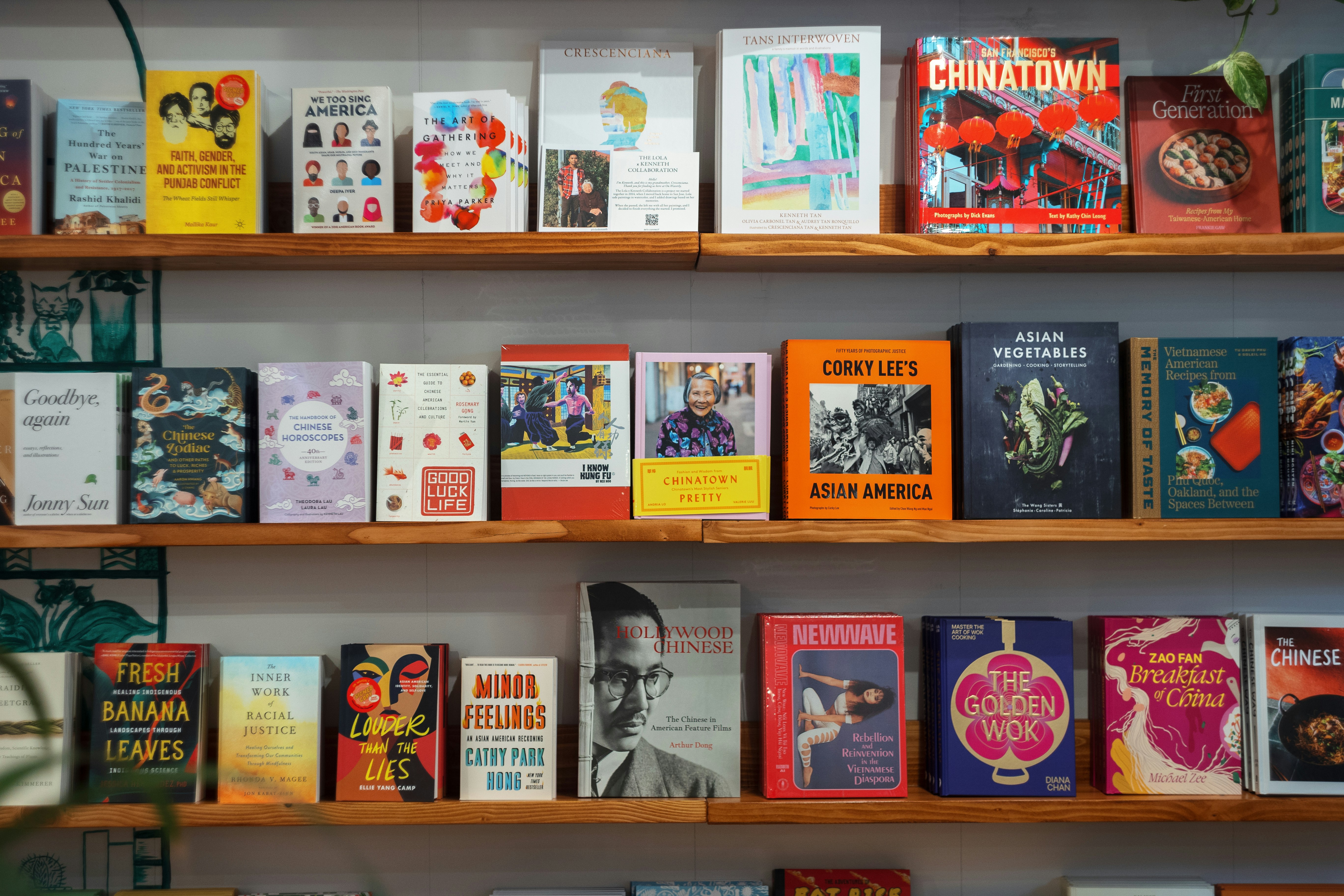 A bookshelf filled with lots of books on top of wooden shelves