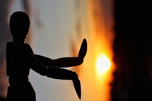 A silhouette of a person holding a knife